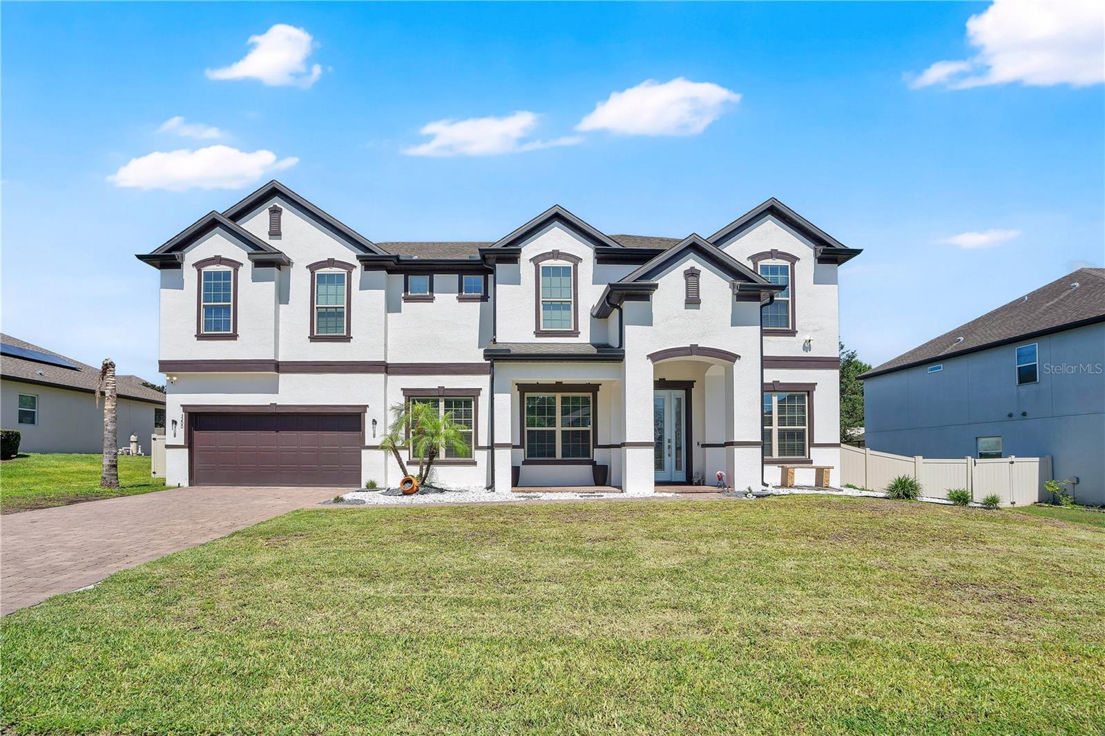 Welcome to this stunning 6-bedroom, 4-bathroom , office and media center, home offering 4,590 square feet of beautifully designed living space. With generous room sizes, impressive entertaining areas, and a backyard built for enjoying Florida living, this home checks every box.
From the moment you step inside, you're greeted by soaring ceilings, abundant natural light, and a spacious open-concept floor plan that creates an inviting atmosphere. The great room flows effortlessly into the kitchen, making it the perfect setting for everyday living, family gatherings, and entertaining guests.
The thoughtfully designed layout offers six generously sized bedrooms, providing plenty of flexibility for growing families, guests, or a home office. Upstairs, a spacious loft features a custom built-in bar, creating the perfect place to unwind or entertain. Just beyond, the dedicated theater room is ready for movie nights, game days, or your favorite streaming series. A large laundry room with a utility sink and an EV charging station in the garage adds convenience to everyday life.
Step outside to your own private backyard retreat. The covered lanai is designed for year-round entertaining with a built-in grill and bar overlooking the sparkling swimming pool. Beautiful paver decking, lush artificial turf, and plenty of open space create the ideal setting for relaxing, hosting friends, or enjoying weekends at home.
Every space has been thoughtfully designed to blend comfort, style, and functionality. Whether you're hosting large gatherings, enjoying quiet evenings by the pool, or simply taking advantage of the home's generous living spaces, this property offers the lifestyle you've been looking for. This is more than just a home; it's a place where lasting memories are made.