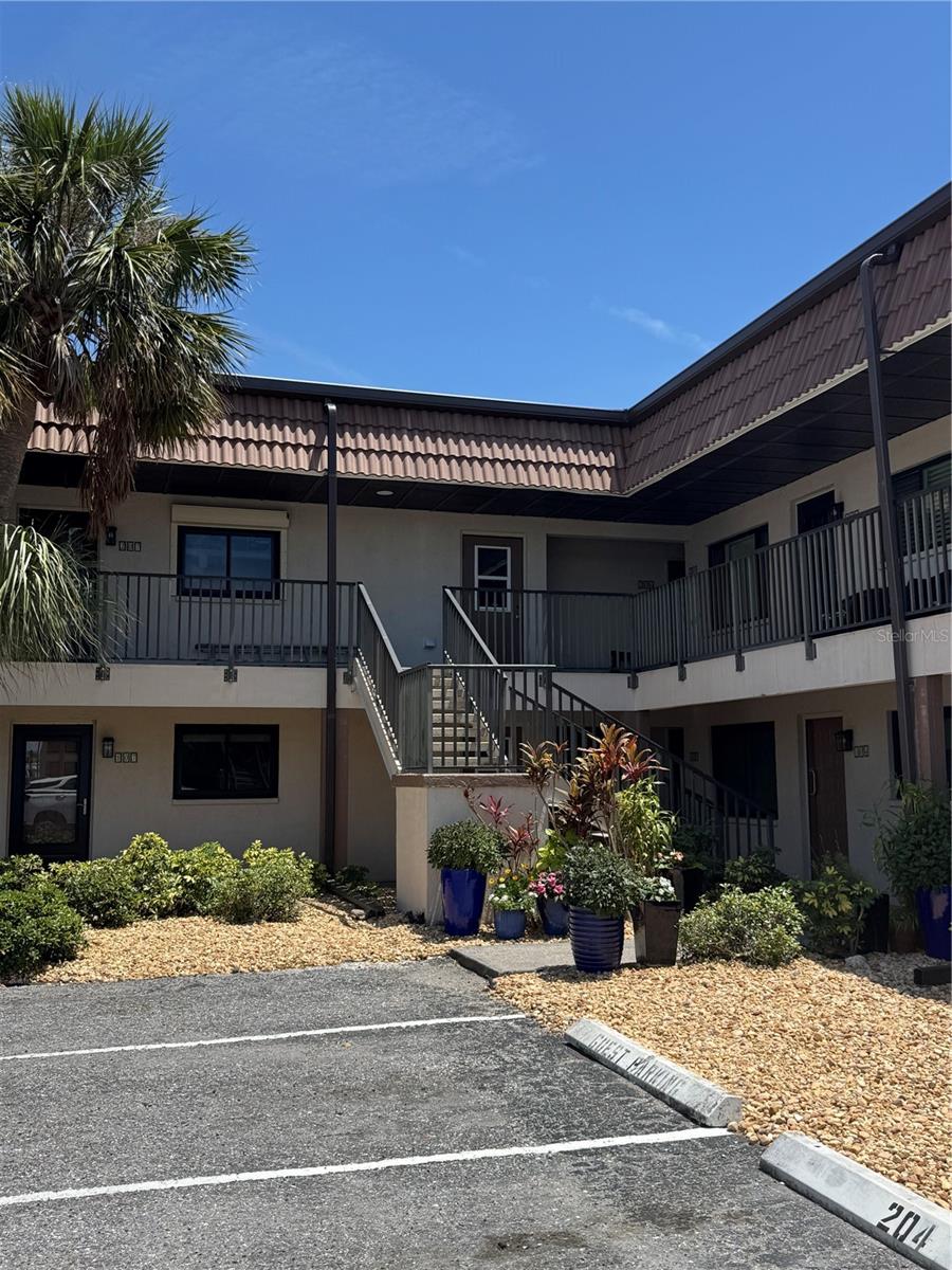 Fully Renovated condominium just 5 Minutes from the Beach! This beautiful unit located only a 5-minute from the beach and is surrounded by everything you need—shops, banks, and restaurants are all just around the corner. Property Highlights: Fully Restored After Hurricane Ian. The renovation was completed by a licensed general contractor. All plumbing drainpipes and connections were replaced, along with the main electrical wiring and panel to meet current code requirements. New Installations: New AC ductwork, Ceiling R-30 and wall R-5 insulation, Hurricane-proof windows, Reinforced floor screeds with premium 12mm waterproof laminate throughout Modern Finishes: Freshly painted walls with a modern color scheme, wooden cabinets in the kitchen and bathroom, Granite kitchen countertop, Stainless steel appliances, Fully renovated bathroom with a new bathtub and tile up to the ceiling Comfort and Efficiency: Modern LED lighting, Ceiling fans with remote control in each bedroom, Brand new 30-gallon water heater. All work has been completed in compliance with current building codes and comes with a guarantee. Don’t miss this opportunity to own a stylish, move-in ready apartment in a prime location near the beach! There is ample parking to include commercial vehicles in back parking lot. You can even have a DOG up to 45lbs as long as it's not higher than 15" high!