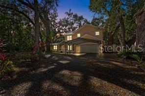A truly rare multigenerational opportunity just minutes from Tampa, this exceptional property offers flexibility, privacy, and space all in one. Situated on a private, wooded, fully fenced lot with no HOA or CDD, 315 Wooten Rd features a 4-bedroom, 2.5-bath main residence plus a separate 1-bedroom, 1-bath in-law suite with its own private entrance—ideal for extended family, aging parents, or long-term guests.

The main home welcomes you with a spacious, light-filled great room with wood flooring, a versatile bonus room perfect for entertaining or additional living space, and an upstairs loft ideal for a home office, study, or play area. The expansive primary suite offers a true retreat with a private sitting area, walk-in closet, and balcony overlooking peaceful lake views, complemented by a spa-inspired bath with a standalone soaking tub and separate shower.

The in-law suite provides both comfort and independence with its own bedroom, full bath, and living area, while still offering convenient access to the main home if desired. Outdoors, enjoy Florida living year-round with screened front and back porches, shaded yard space, and two storage sheds—perfect for hobbies, gardening, or gatherings.

With a circular driveway, 2-car garage, and 2-car carport, there is ample parking for RVs, boats, trailers, or multiple vehicles. Offering unmatched versatility and privacy in a prime location, this property is a unique opportunity you don’t want to miss.
Property highlights: newer AC, Septic tank serviced in 05/2026, exterior paint 2024, the seller will contribute $3500 for replacement of second AC unit ( size 1 ton)