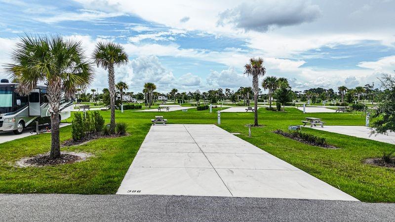 Welcome to Resort at Canopy Oaks, a gated luxury RV and tiny home community in Central Florida offering resort-style amenities and long-term ownership value. The community features a beautiful clubhouse, heated pool and spa, fitness center, pickleball courts, dog park, and an active social calendar — all within a meticulously maintained and professionally managed setting.

Lot 386 is a deluxe site ideally positioned in the heart of the community, placing you right in the center of the action with convenient access to the amenities and nearby bathhouse. Its prime central location offers both accessibility and strong rental appeal, making it an excellent choice for personal use or investment.

Ownership provides deeded property within a professionally managed resort known for strong seasonal demand and rental potential. Ask about current developer incentives, including special pricing and lot improvement opportunities.

Schedule your private tour today and secure your place in this sought-after Florida resort community.