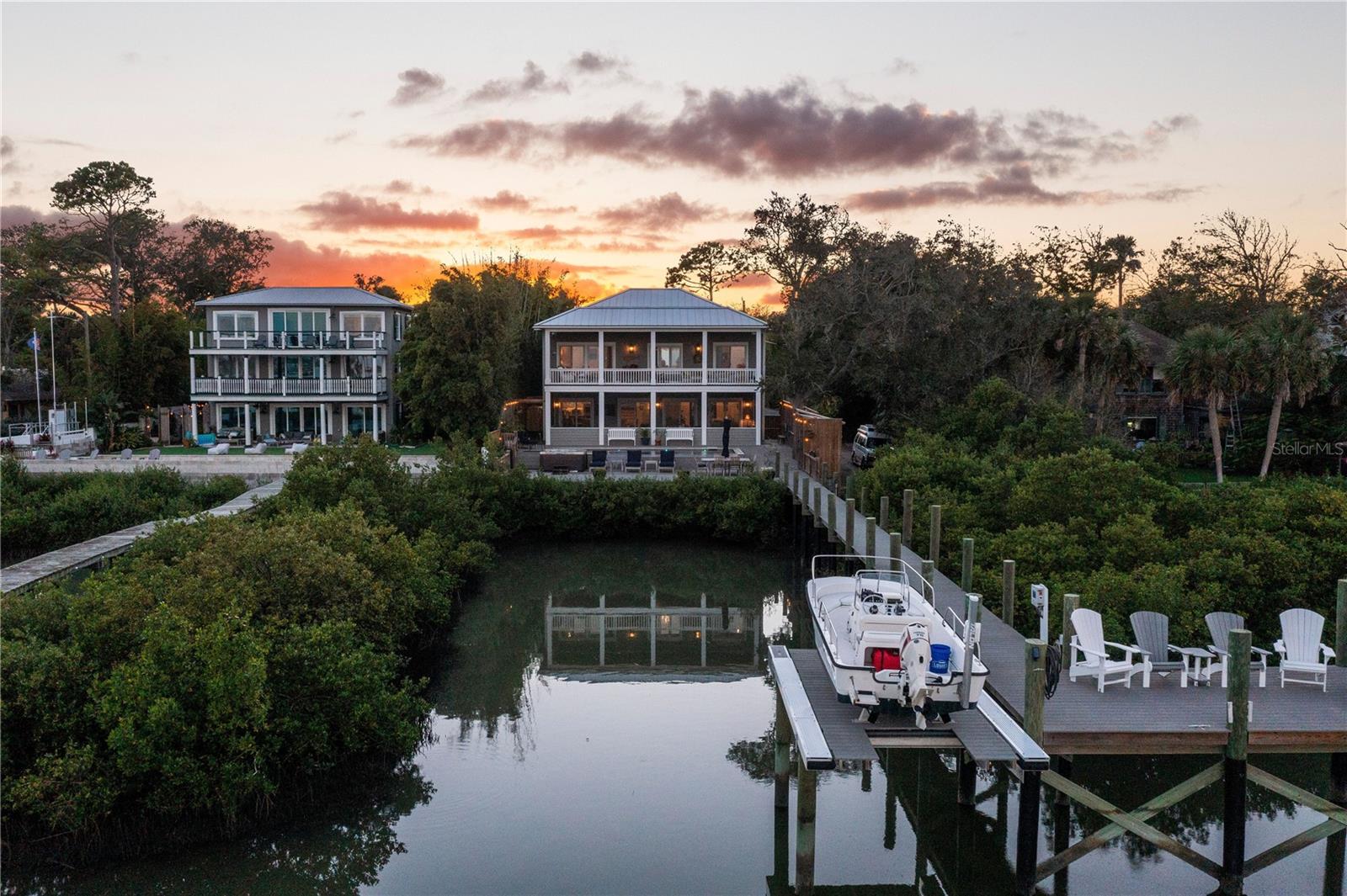 Experience waterfront luxury in this St. Augustine home, perfectly poised on the Intracoastal, offering unobstructed views of the city’s treasures. From the sparkling Intracoastal waterway to the historic landmarks like Porpoise Point, Vilano Bridge, and the iconic Lighthouse, this property captures St. Augustine's essence. Rebuilt in 2020, this home seamlessly blends historical charm with modern elegance. No expense was spared during the renovation; every corner exudes quality. The open-concept design connects the living room, dining area, and gourmet kitchen, all overlooking the mesmerizing outdoor space. The kitchen, a chef’s dream, features a gas range, Wolf appliances, and a charming whitewash brick backsplash. Above the garage, a versatile space serves as a game room or a fourth bedroom, perfect for entertainment.

Upstairs, three bedrooms and two full bathrooms await. The primary bedroom offers a spacious sanctuary with walk-in closets and balcony access for sunrise views over the water. The ensuite bathroom is a luxurious retreat with a soaker tub, double vanity, and a standalone shower. The garage, a rarity in downtown St. Augustine, is equipped with temperature control and water supply, ideal for hobbies.

Outside, an infinity pool and hot tub offer relaxation against the Intracoastal backdrop. Trex Decking extends to the backyard/dock, complementing the outdoor shower and no-profile boat lift, making this a boater's paradise. Imagine enjoying 4th of July fireworks from your private dock or strolling to restaurants and shops. This home embraces St. Augustine’s essence, offering a lifestyle beyond compare. Don’t miss this chance to own historic charm, modern luxury, and waterfront marvels.
