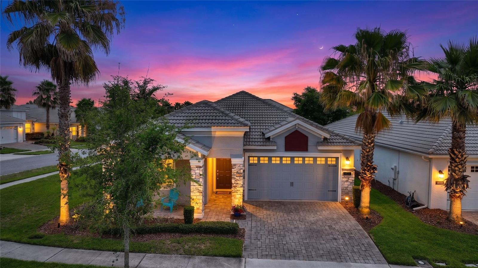 One or more photo(s) has been virtually staged. Fall in Love with this beautiful 4 bedroom 3 bathroom home on a corner lot in the highly desirable Guard Gated ChampionsGate Country Club. Enjoy peaceful mornings with coffee on your charming front porch or end the long Summer days with amazing sunsets. This home was designed to please everyone with plenty of space to relax including an expansive great room that fills with natural sunlight throughout the day. Entertain friends and family effortlessly with the open floor plan, large granite center island, upgraded solid wood cabinets, stainless steel appliances and pantry with plenty of storage. The primary bedroom is the perfect place to unwind after long days in the Florida sun with the private ensuite bath which offers dual vanities, garden tub, separate shower and large walk in closet. Spend your days on the Golf Course or at one of the many luxurious resort style amenities. HOA monthly dues include full unlimited golf and tennis club membership, a $75 monthly dining credit at Plaza, high-speed internet, cable, phone service, complete lawn care, and 24-hour security monitoring. Residents enjoy exclusive access to three world-class amenity centers, including the Oasis Club, Plaza Clubhouse, and Retreat Club. Trash pickup and CDD fees are conveniently included in the annual property taxes. No short-term rentals permitted. Ideally located just minutes from Walt Disney World, Posner Park, Margaritaville, major airports, shopping, dining, entertainment, medical facilities, and more. Schedule your private showing today and start living like a Champion!