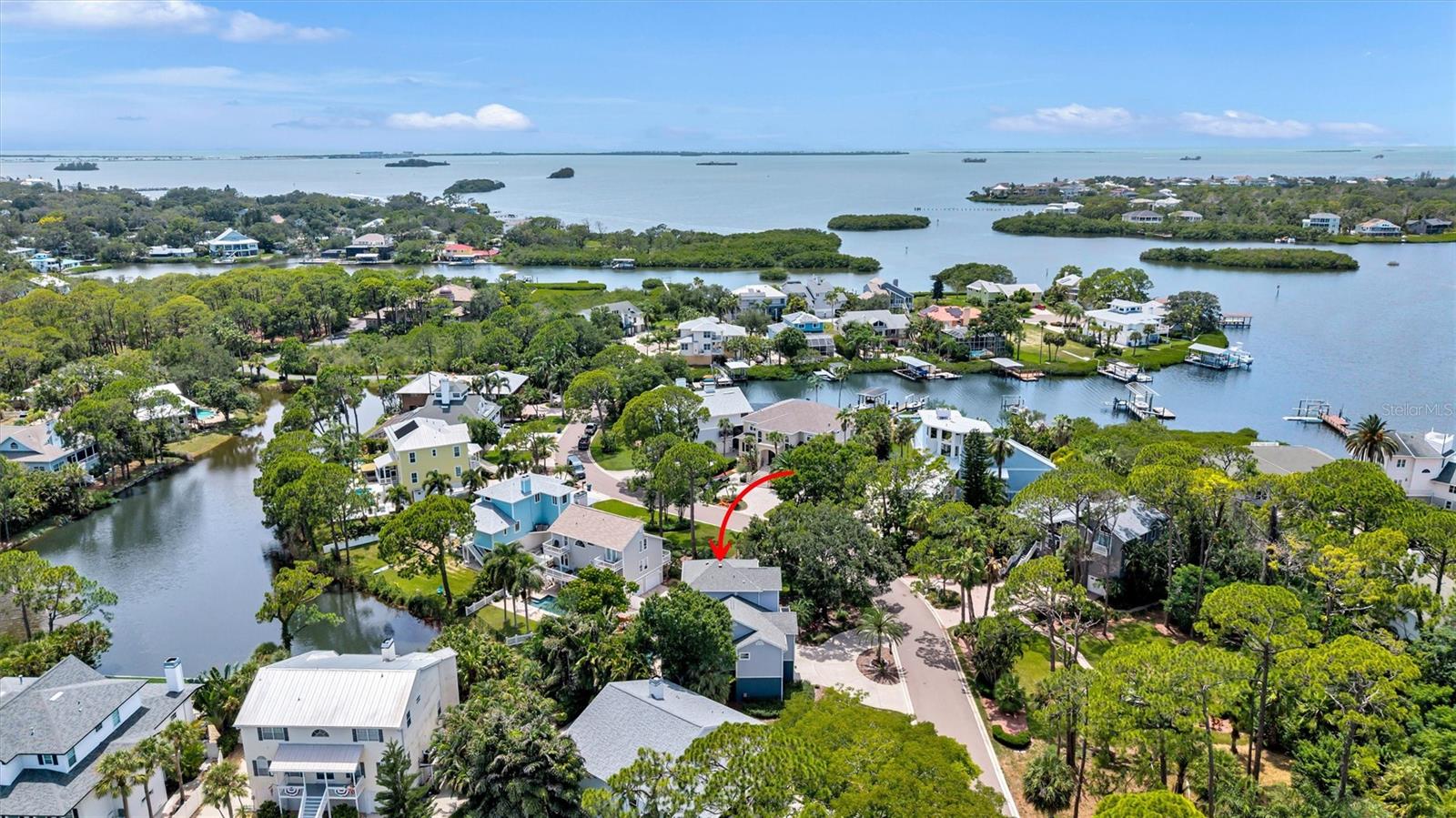 Welcome to 760 Soundview Drive, a stunning Key West-style retreat in the heart of Ozona, one of Palm Harbor's most sought-after waterfront communities. Offering 4 bedrooms, 2.5 bathrooms, an oversized 2+ car garage, and a sparkling pool with a cascading waterfall overlooking a picturesque saltwater canal, this home perfectly captures the Florida lifestyle. From the moment you step inside, you'll be welcomed by soaring ceilings, abundant natural light, and a warm, inviting atmosphere. A spacious formal living room at the front of the home provides an elegant space for entertaining guests or enjoying a quiet retreat. Beyond, the expansive family room features a cozy gas fireplace and sliding glass doors that open to a balcony overlooking the pool and canal, creating the perfect setting for relaxing or gathering with family and friends. The beautifully appointed kitchen offers granite countertops, bar seating, custom cabinetry, decorative tile backsplash, and stainless-steel appliances. A beautifully renovated guest bathroom on the main level showcases stylish, modern finishes. Three generously sized guest bedrooms feature luxury vinyl plank flooring, while the entire third floor is dedicated to an impressive owner's retreat with peaceful water views, a spacious walk-in closet, and an oversized walk-in attic for exceptional storage. The luxurious ensuite bath includes dual vanities, a large walk-in shower, and a relaxing jetted soaking tub. Thoughtfully updated throughout, this meticulously maintained home features freshly sanded and stained hardwood floors with brand-new carpet runner on the staircase (2026), a new closet in the fourth bedroom (2026), fresh exterior paint plus newly painted decks (2025), a new hot water heater (2025), new pool pump (2024), hurricane-impact windows across the front of the home, a new impact-rated downstairs slider (2022) plus a new roof (2020) and AC system (2020), providing years of worry-free living.
The lower level offers an additional 288-square-foot climate-controlled bonus room with a half bath (not included in the heated square footage), ideal as a game room, fitness room, home office, or guest retreat with easy access to the pool. The oversized garage offers soaring ceilings, abundant storage, golf cart parking, and an additional bonus room perfect for an office, workshop, or extra storage.
Life on Soundview Drive is about more than just owning a beautiful home—it's about becoming part of a vibrant community where neighbors quickly become friends. Walk or ride your golf cart to local restaurants, charming boutiques, and top-rated schools including Palm Harbor University High School. The Pinellas Trail is just around the corner, offering miles of scenic biking, walking, and running. Nearby Pop Stansell Park features a waterfront fishing pier, playground, and hosts the beloved Downtown Palm Harbor Community Market every third Saturday with live music, food trucks, local vendors, and family-friendly activities. You're just minutes from world-class golf at Innisbrook Golf Resort, waterfront dining, marinas, and the award-winning beaches of Honeymoon Island, where crystal-clear Gulf waters, sugar-white sand, and unforgettable sunsets await. If you've been searching for a home that combines waterfront living, timeless coastal charm, modern updates, and an unmatched community lifestyle, **760 Soundview Drive ** is the one you've been waiting for. Note-Furnishings are negotiable!