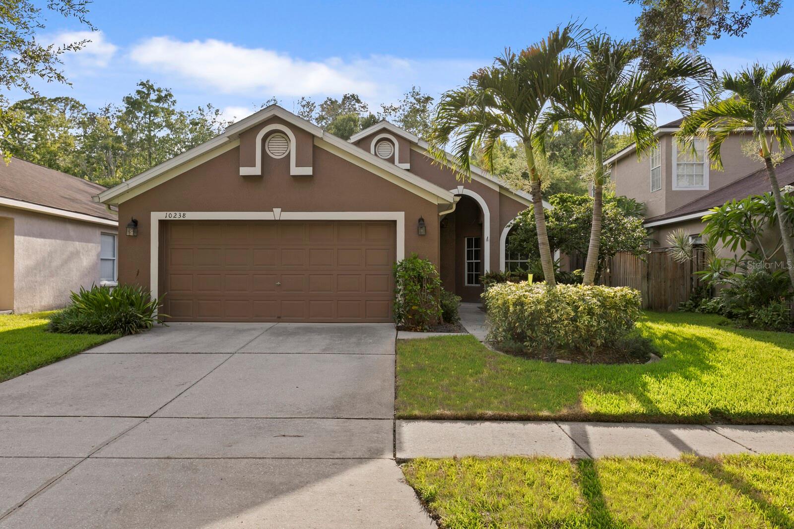 Virtually Staged. Welcome to the highly sought-after community of Westchase, one of Tampa's premier master-planned neighborhoods known for its tree-lined streets, top-rated schools, outstanding amenities, and convenient location. Discover this dependable, highly functional ONE STORY 3-bedroom, 2-bathroom home that offers an efficient floor plan. Situated on a wonderful street on a CONSERVATION LOT, this well-maintained home features numerous updates already completed, providing a solid foundation for your personal design vision. Various improvements include Roof replaced (2016), HVAC system replaced (2018), beautifully remodeled kitchen with granite countertops, guest bathroom remodeled with new shower, cabinetry  and granite countertop (2020), gas water heater replaced (2018), garage door replaced (2024), house exterior repainted  (2022) and refrigerator replaced  (2020).  Additional features include wood blinds, ceiling fans, washer and dryer, and curtain rods, all of which convey with the home. The BRICK PAVERED back PATIO is ideal for outdoor living. Whether you're looking to move right in and update over time or create your dream home in one of Tampa's most desirable communities, this property presents an outstanding opportunity to add your personal style while benefiting from many major system updates already completed. Just minutes from Tampa International Airport, downtown Tampa, shopping, dining, and some of Florida's award-winning Gulf beaches, this home offers an exceptional opportunity to make it your own.