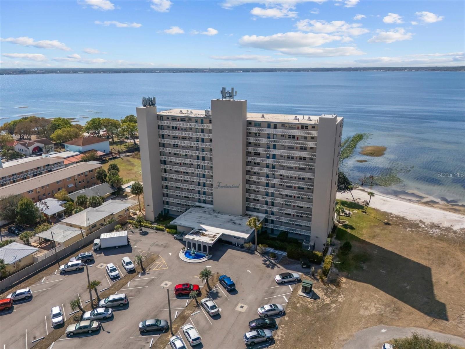 Welcome to effortless lakefront living at 2131 Lakeview Drive, Unit 904 in Sebring. This beautifully positioned 2-bedroom, 2-bath condominium captures sweeping water views and the peaceful rhythm of Florida life—perfect as a seasonal retreat, full-time residence, or investment opportunity.From the moment you enter, the lake takes center stage. Large windows frame sparkling morning water and vibrant sunset skies, offering a serene backdrop for coffee at sunrise or relaxing evenings at home.The thoughtfully designed layout includes two spacious bedrooms and two full bathrooms, providing flexibility for guests, a home office, or rental potential. Community washers and dryers offer easy laundry access, while dedicated storage space keeps seasonal items neatly organized—ideal for lock-and-leave convenience.Enjoy the convenience of your own assigned parking space just steps from the building entrance, adding everyday ease whether you’re arriving for the season or welcoming guests.Located in the desirable Fountainhead Condominium community, residents enjoy a sparkling pool, clubhouse, fitness facilities, and beautifully maintained lakefront grounds. The setting offers both relaxation and connection, with amenities designed for comfortable, low-maintenance living.Just minutes away, historic downtown Sebring—recently revitalized and featured on HGTV—offers locally owned restaurants, boutiques, coffee shops, art galleries, and year-round events centered around the iconic Circle.Whether you’re escaping winter, simplifying your lifestyle, or expanding your investment portfolio, this lakeview condo offers location, convenience, and lasting appeal.Experience the views. Enjoy the amenities. Invest in the lifestyle.