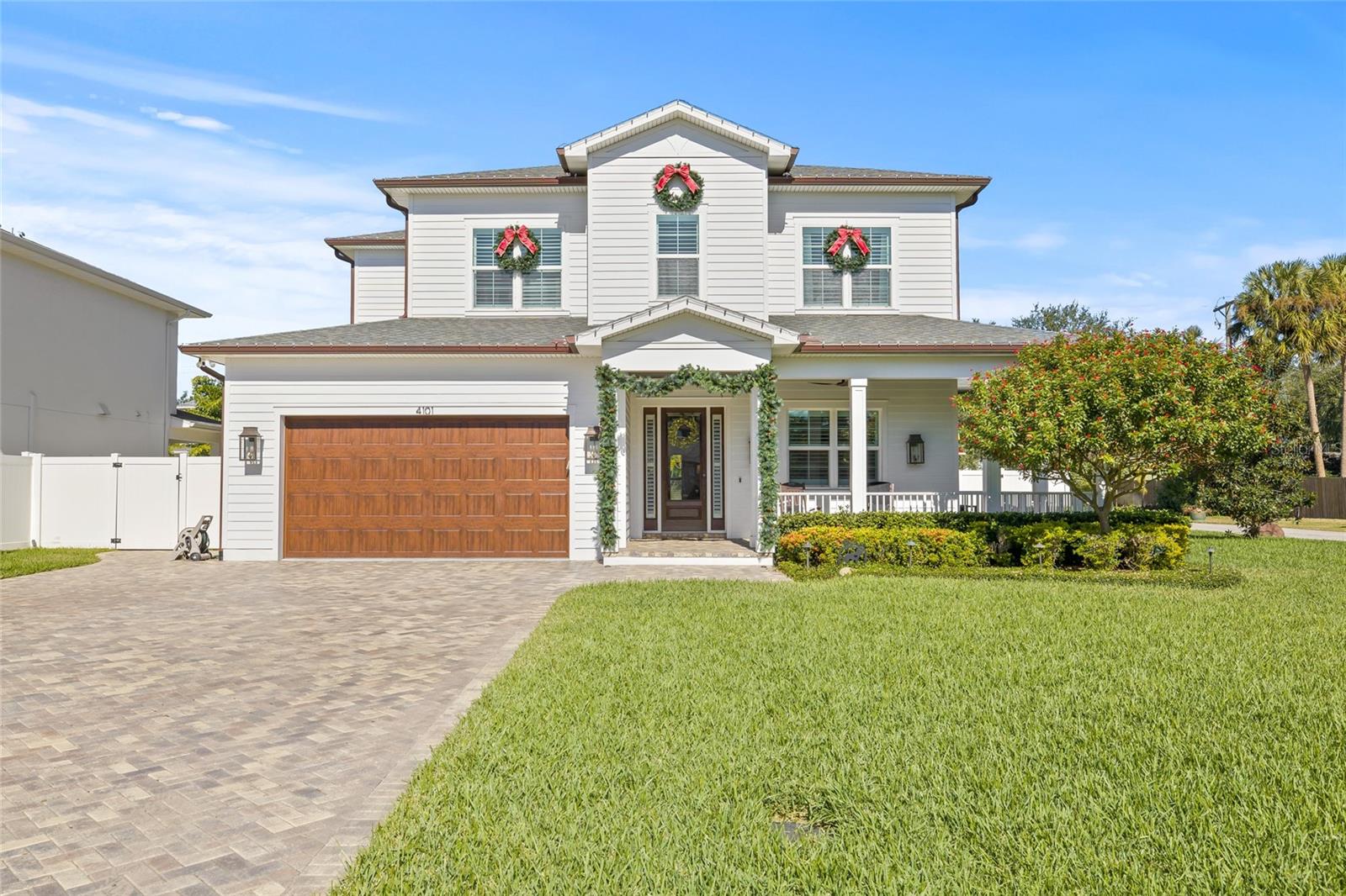 Experience refined elegance in this Barritz Builder's craftsman style masterpiece.  Built in 2019, this exceptional home stands as a testament to craftsmanship and design, remaining high and dry through recent storms.  Thoughtfully curated with over $350,000 in custom upgrades, it offers luxury at every turn.  Step onto the welcoming front porch, the perfect prelude to the elegance that awaits inside.  Upon entering you are greeted by an abundance of light cascading through expansive windows and illuminating the soaring ceilings and impeccably crafted details.   The heart of the home is a chef's gourmet kitchen, featuring Thermador SS appliances, a gas range, quartz countertops, and a stunning marble tile backsplash.  Adjacent to kitchen is the bright and inviting breakfast nook that offers the perfect spot to enjoy casual meals.  A butler's pantry with a wine cooler adds convenience for entertaining.  The open-concept floor plan flows effortlessly from the kitchen to the great room, with a separate dining room, dedicated office and downstairs bedroom to include pool bath for added functionality.  This home boasts 10' ceilings throughout, showcasing impeccable attention to detail, including solid core 8' doors and American Hickory engineered hardwood flooring.  The exterior shines with $30,000 in copper gutters and $110,000 in professional landscape and lighting, full in-ground irrigation system with timer, whole house generator and $130,000 in solar panels to ensure energy efficiency and peace of mind.  Electric bills are dramatically reduced! Home was built to current hurricane codes.  Upstairs, retreat to the luxurious primary suite, complete with tray ceilings, a modern electric fireplace, and an expansive spa-like en-suite.  The master bath features dual vanities, a freestanding tub, a glass enclosed shower with three showerheads and two linen towers.  The enormous custom walk-in closet is every shoe lovers dream and includes an island with built in drawers designed for even the most discerning wardrobe.  Additional features include:  Dual tankless water heaters, energy efficient Low E windows, 5 year old Dual-zoned HVAC system, brick paver driveway, surround sound system, security system, whole house water softener, and complete with a 2-10 Home Buyers Warranty.  Outdoors enjoy the covered lanai with tongue and groove ceilings.  There is a custom saltwater pool and spa, complete with outdoor kitchen, sink and built in gas grill.  All is surrounded by lush landscaping, and a fire pit, creating your private oasis.  With timeless beauty and state-of-the-art amenities, this home redefines luxury living.   Home is located in the heart of South Tampa!  Close to shopping, airport, mall and zoned for top rated schools:   Grady Elementary, Coleman Middle and Plant High School.  Actual sq footage is 4,226 heated and 5,398 under roof.