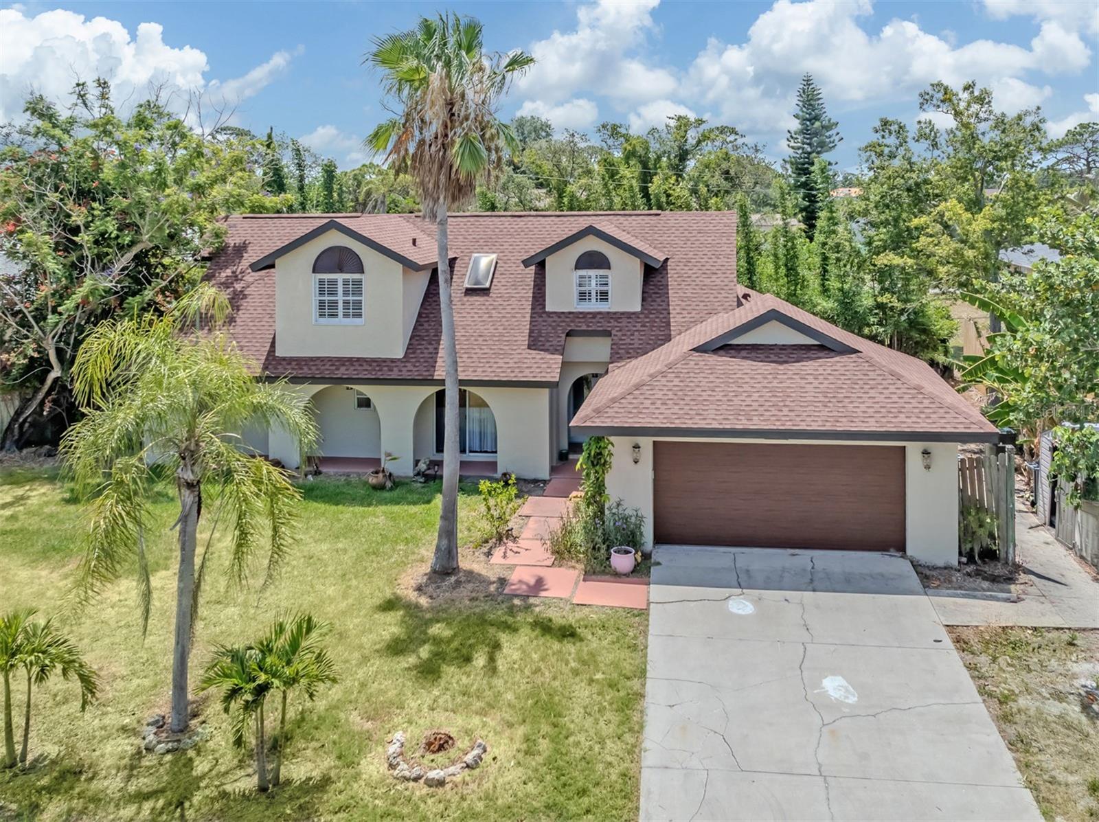 Experience Florida coastal living in one of South Venice's most established and desirable communities. Thoughtfully updated throughout, this residence offers a seamless blend of comfort and resort-inspired outdoor living. A freshly painted exterior and new roof create an impressive first impression, while elegant double-glass entry doors open to expansive living spaces filled with natural light. The open concept flow is complemented by soaring ceilings, multiple access points to the pool and a beautifully appointed kitchen featuring shaker-style cabinetry with soft-close construction, tongue-and-groove detailing, an open pantry design, premium KitchenAid appliances, and a gas range for culinary enthusiasts. The primary suite is thoughtfully positioned tucked away on the main level, offering private access to the pool, with spacious walk-in closet offers newly installed flooring to complement the retreat. Upstairs, each bedroom is individually climate-controlled with its own air-conditioning system, ensuring year-round comfort. Bathrooms are exquisitely renovated spa-inspired ensuite showcases exceptional finishes and refined design. Designed for enjoying the Florida lifestyle, the expansive screened lanai overlooks a heated saltwater pool, creating a private retreat for relaxation and entertaining. Mature banana trees, bamboo privacy screening, fenced yard, and an irrigation system further enhance the property's outdoor appeal. The air-conditioned garage features a new garage door, epoxy flooring, and a MyQ smart garage system. Additional highlight includes a 250-gallon EcoWater treatment system. Offering a rare combination of modern enhancements, thoughtful design, and exceptional outdoor living, this South Venice residence presents an outstanding opportunity to enjoy the Florida Gulf Coast lifestyle. With no HOA fees, no CDD fees, and no deed restrictions, this property offers a rare sense of freedom and flexibility seldom found in today's market. Whether envisioned as a full-time residence, seasonal escape, or coastal retreat, the opportunities are as limitless as the lifestyle itself. South Venice is cherished for its unique blend of laid-back coastal charm and exceptional recreational amenities. Residents have the option to enjoy access to the private South Venice Beach Ferry, operated throughout the day by a licensed captain, providing passage to an exclusive stretch of pristine Gulf shoreline. Optional annual memberships also grant access to the community boat ramp, offering effortless opportunities for boating, fishing, paddleboarding, and kayaking along the Intracoastal Waterway. For those who enjoy an active outdoor lifestyle, the community features tennis and basketball courts, a playground, and miles of scenic walking and biking trails through nearby Shamrock Park. The renowned Legacy Trail is also just moments away, connecting South Venice to Downtown Sarasota and continuing north to the University Town Center area. Adding to the waterfront appeal, the neighborhood yacht club and kayak launch are conveniently located just two lots away. Ideally positioned near Manasota Beach and the charming shops, dining, and cultural attractions of Venice Island, this exceptional location offers the perfect balance of tranquility, recreation, and convenience. South Venice remains one of the area's most treasured coastal communities—peacefully tucked away, yet remarkably connected to everything that makes Gulf Coast living so desirable
