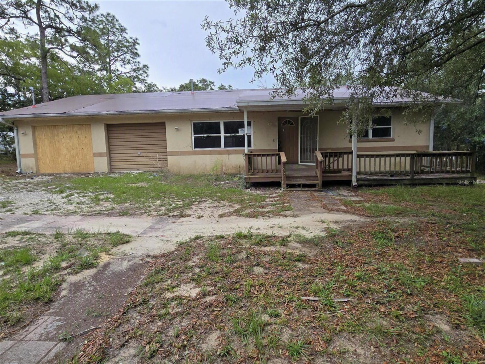Auction Property. 3/2/2 on 3/4 acre private gated road.