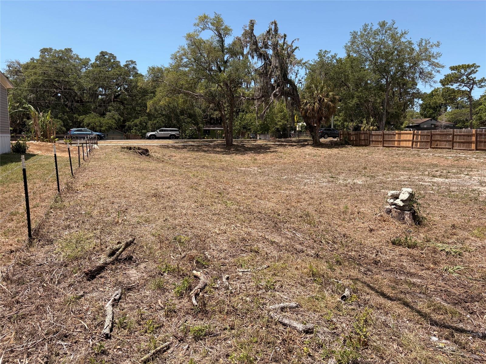 Are you looking for your forever home or winter retreat?  Cleared & high & dry partially cleared vacant .44 acre property with utilities nearby on a paved street with sidewalks.  No HOA or CDD fees.  Water, electric hook up and sewer hock up across the street for easy access.  Fantastic location close to Tampa and the beaches centrally located for amazing accessibility.  Zoned to allow for built homes or mobile / modular homes.  Ask about loan options with only 5% down to buy the property and the home all together.