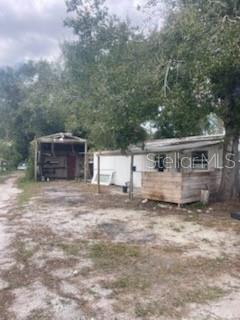 Investor special or affordable move-in ready opportunity in North Fort Myers! Discover this spacious 3 bed, 2 bath triple-wide manufactured home built in 1970 on a large 0.70+ acre parcel of owned land (a LARGE fenced-in LOT with NO LOT RENT!) NO HOA, offering endless possibilities for living, investing, or expansion. This home is vacant and move-in ready, featuring window AC units in every room plus a large AC unit serving the main living area for added comfort. Major improvements are already completed, including a new water heater just over 1 year old (2025), and a roof fixed in 2023 (less than 3 years old) for added peace of mind. Enjoy ample open parking on the concrete driveway, along with a covered carport / storage area ideal for vehicles, tools, or hobbies. The chain-link fenced backyard spans over half an acre 0.70+ acres of land, providing exceptional space for pets, outdoor activities, or future enhancements, while the rear open porch is perfect for relaxing, grilling, or enjoying quiet Florida evenings. Set on private well and septic, this expansive property delivers privacy and flexibility rarely found. Conveniently located in North Fort Myers, you’re just minutes from local dining, shopping, parks, and easy access to major roadways, making daily errands and commuting a breeze. Seller financing and private financing available. Don’t wait...opportunities like this won’t last long!