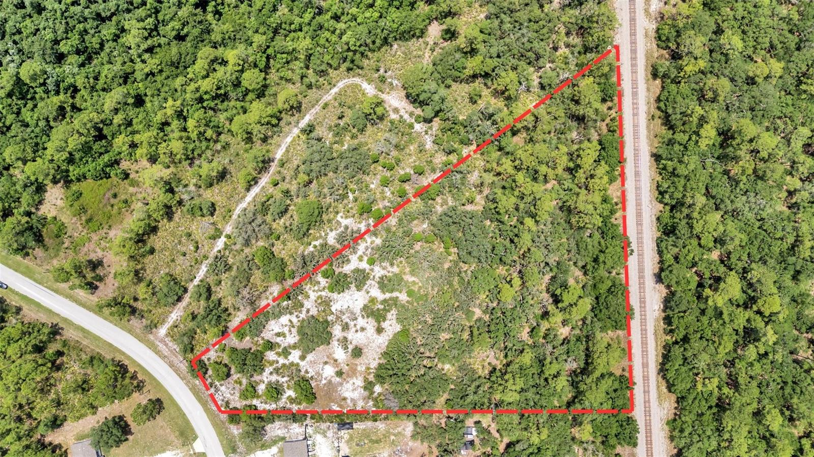 LAKE CALOOSA LANDING- Discover the perfect blend of space, privacy, and convenience with this beautiful 2.78 acre wooded parcel in Lake Caloosa Landing. Nestled among native Florida trees, this property offers endless possibilities for your dream home, weekend retreat, or private country escape.
Enjoy the peace and tranquility of rural living while remaining centrally located in the heart of Florida. Just over an hour from Orlando-area attractions, approximately 30 minutes from Legoland, less than 2 hours from Florida’s east and west coast beaches, and about 45 minutes from the world-famous Sebring International Raceway.