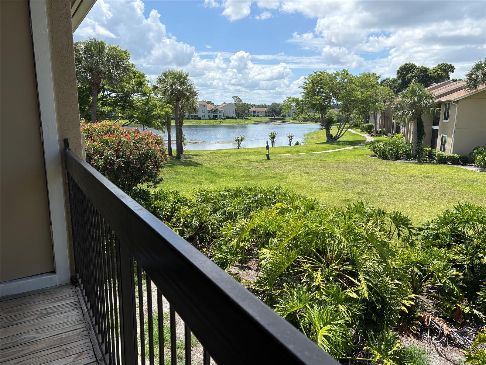 BEST BUY.... Second-floor condo offering tranquil views of the green space and lake. Inside, you’ll find 2 bedrooms, 2 baths, great room, dining room and kitchen—ideal for everyday living or welcoming family and friends. The primary suite features water view. Additional highlights include cathedral ceiling, walk-in closets in both bedrooms, an inside laundry area and exterior storage closet located on the lanai. Recent improvements include roof 2025, new microwave 2025, and water heater replaced 2021... Vintage Grand on Palmer Ranch has undergone building improvements, including roofs, impact-rated windows, exterior paint and stucco work. Residents enjoy resort-style amenities, including a clubhouse, community pool, fitness center, tennis and basketball courts, playground, picnic areas, and a scenic walking trail around the lake. The monthly association fee provides exterior maintenance, roof upkeep, building insurance, pest control, and landscaping. Ideally located just minutes from Siesta Key Beach, Legacy Trail, Potter Park, Sarasota Family YMCA, golf courses, Costco Wholesale, downtown Sarasota, Venice, and UTC Mall. Pickleball enthusiasts will love the nearby courts, and the exciting SARASOTA SQUARE MALL REDEVEOPMENT brings Whole Foods, HomeSense, new dining, shopping, and entertainment options to the area. This condo delivers a great opportunity for seasonal or year-round living in Sarasota. Schedule your showing today!