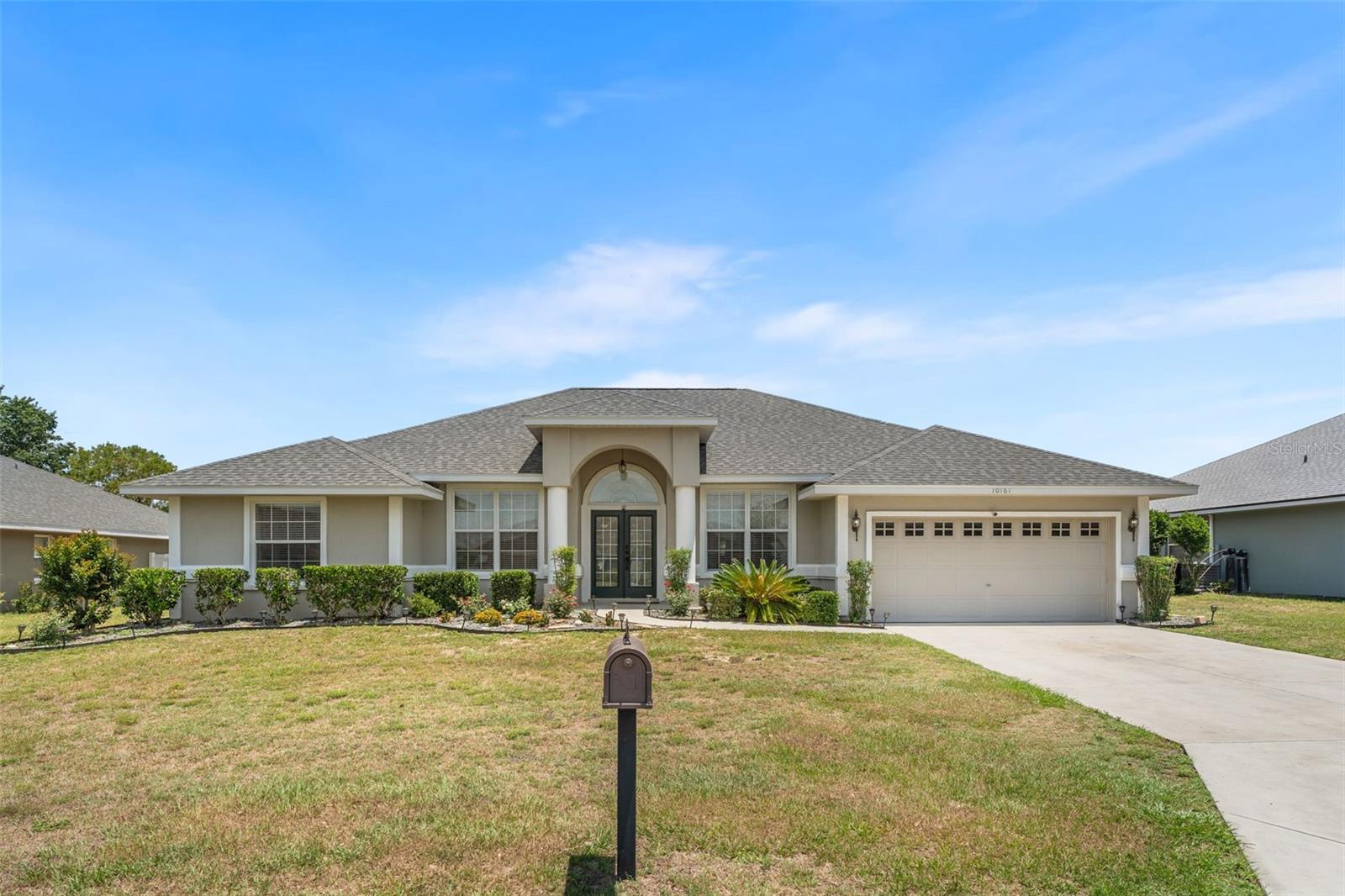 Located in the desirable Diamond Ridge community of Belleview with NO HOA, this well maintained 4 bedroom, 3 bath home offers 2156 living square feet on a 0.26 acre lot with a completely fenced in back yard. Built in 2007, the home features an inviting open layout with a triple split plan design, newer flooring throughout, updated 5-inch baseboards, and fresh interior paint. Triple sliding glass doors lead to the back lanai, creating an ideal space for relaxing or entertaining. The kitchen is in the heart of the home and overlooks the main living areas, while the spacious primary suite includes a custom built-in closet system and an updated en suite bathroom. Home has been maintained and the home reflects pride of ownership throughout. Recent improvements include a 2024 roof, 2020 4-ton HVAC system, 2020 water heater, and updated kitchen appliances. Walking distance to the Belleview Sports Complex and within the Belleview school district. With no HOA fees or deed restrictions, this property offers flexibility and comfort in a convenient location.
