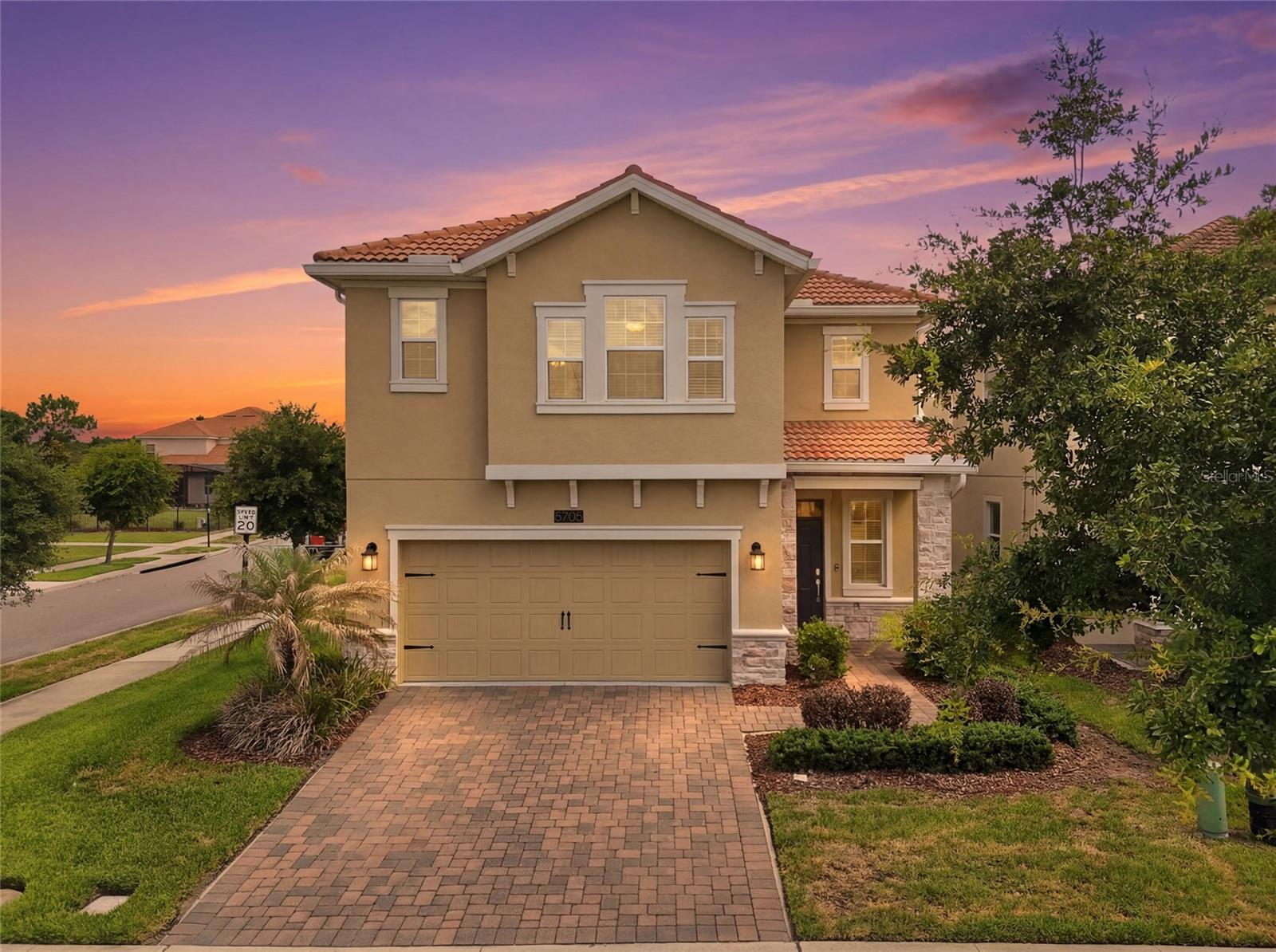 MOTIVATED SELLER! FULL GOLF MEMBERSHIP INCLUDED! Experience resort-style living in the highly sought-after Champions Gate Country Club! This beautifully maintained 4-bedroom, 2.5-bath home offers 2,346 square feet of living space and sits on a premium corner lot overlooking the 8th hole, with stunning pond and fountain views. The gourmet kitchen features quartz countertops, 42” cabinetry, newer appliances, and a large center island perfect for entertaining. The spacious primary suite offers a walk-in closet, dual vanities, a soaking tub, and a tiled walk-in shower. Recent updates and features include fresh interior and exterior paint, gutters, a whole-home water treatment system, and an air purification system. Just steps from the residents-only North Pool and green space, you'll also enjoy access to world-class amenities including the Oasis Club, The Plaza, and the Retreat Waterpark. The HOA includes full golf and tennis membership, gated security, lawn care, cable, internet, trash service, and security monitoring—providing a truly maintenance-free lifestyle. Conveniently located near Disney, major highways, shopping, dining, and entertainment, this home offers the perfect blend of luxury, convenience, and Florida living.