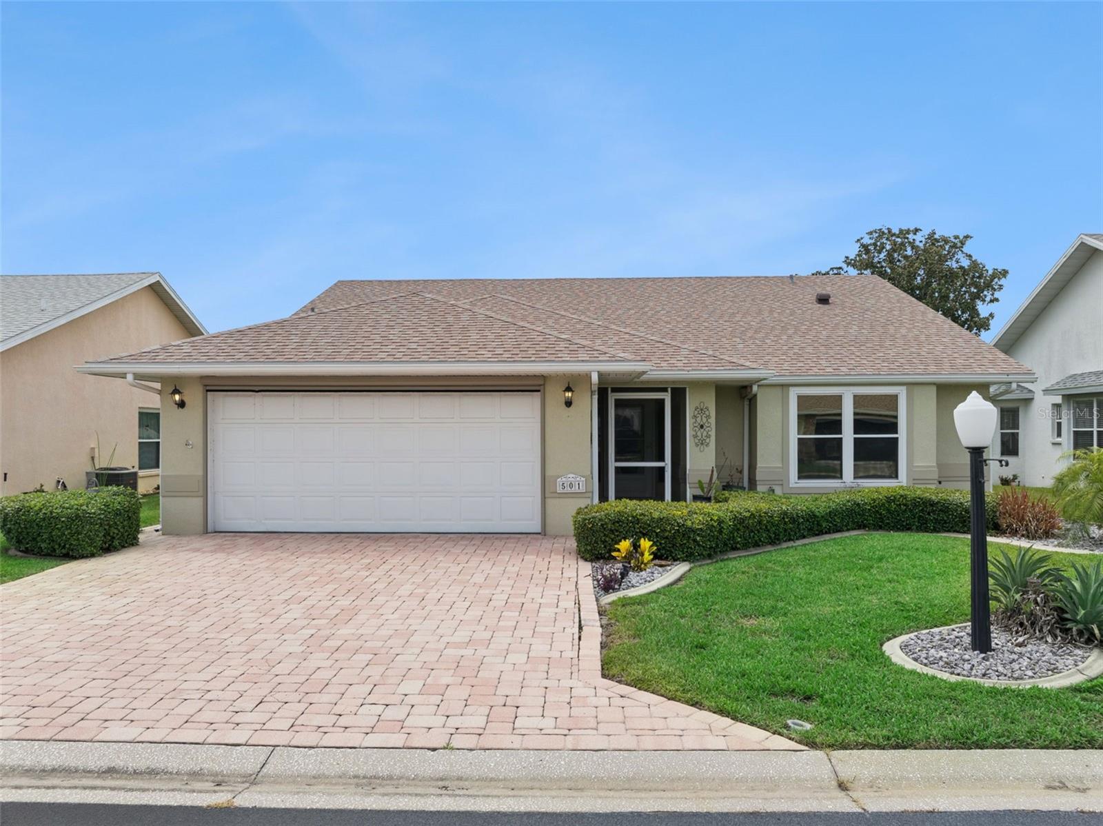 Located in the highly desirable gated community of Lake Henry Estates, this wonderful 2-bedroom, 2-bath home is perfectly sited on a premium golf course-front lot with picturesque pond views. Being offered fully furnished and turnkey, this home is move-in ready and ideal for enjoying the Florida lifestyle from day one.

Upon arrival, you're welcomed by a charming screened-in front porch with tile flooring—an inviting space to relax and enjoy the peaceful surroundings. Inside, the open-concept floor plan showcases breathtaking views of the pond and golf course. The spacious living room features vaulted ceilings, hidden pocket triple glass sliding doors, and solar tube skylights that fill the space with an abundance of natural light.

The eat-in kitchen is appointed with oak cabinetry featuring pull-out drawers, two pantry closets, a double-bowl stainless steel sink with a gooseneck faucet, and a breakfast bar adorned with granite countertops. The charming breakfast nook provides the perfect spot to enjoy your morning coffee while taking in the tranquil pond views.

The bright and airy Florida room is surrounded by oversized windows, seamlessly blending indoor and outdoor living while offering panoramic views of the golf course and pond. Easy-to-maintain solid surface flooring extends throughout the main living areas.

The generously sized primary bedroom suite features vaulted ceilings, a walk-in closet, and sliding glass doors that provide private access to the Florida room. The en-suite bathroom is equipped with dual vanities, a linen closet, a comfort-height toilet, and a walk-in shower.

Outdoor living is a true highlight of this home. Relax on the screened-in lanai or the open patio while enjoying sweeping views of the tranquil pond and beautifully maintained golf course.

Additional Features: Fully furnished and turnkey, Guest bedroom with direct access to the guest bathroom, Washer and dryer included, Architectural shingle roof (2023), Insulated lanai roof (2023), Split Heat Pump HVAC System (2018) with UV light purifier, Water heater (2024), Refrigerator & Freezer located in the garage, Paved driveway and walkway, Irrigation system, Two-car garage with garage door opener, Retractable garage screen door. 
Residents of Lake Henry Estates enjoy an exceptional selection of resort-style amenities, including a lakefront clubhouse with a pub, heated swimming pool and spa, pickleball and tennis courts, ballroom, card tournaments, library, billiards room, craft room, fitness center, shuffleboard, horseshoes, bocce courts, woodworking shop, dog park, boat slips, and a 9-hole executive golf course. Optional golf memberships, boat slips, and boat/RV storage are available for a modest additional fee.

The monthly maintenance fee of $300 includes 8,000 gallons of water, sewer service, cable TV, internet, clubhouse amenities, and maintenance of the community's common areas, providing outstanding value and a truly maintenance-free lifestyle.

Ideally located near shopping, restaurants, medical facilities, I-4, and Central Florida's world-famous theme parks, this exceptional home offers the perfect combination of comfort, convenience, and resort-style living.