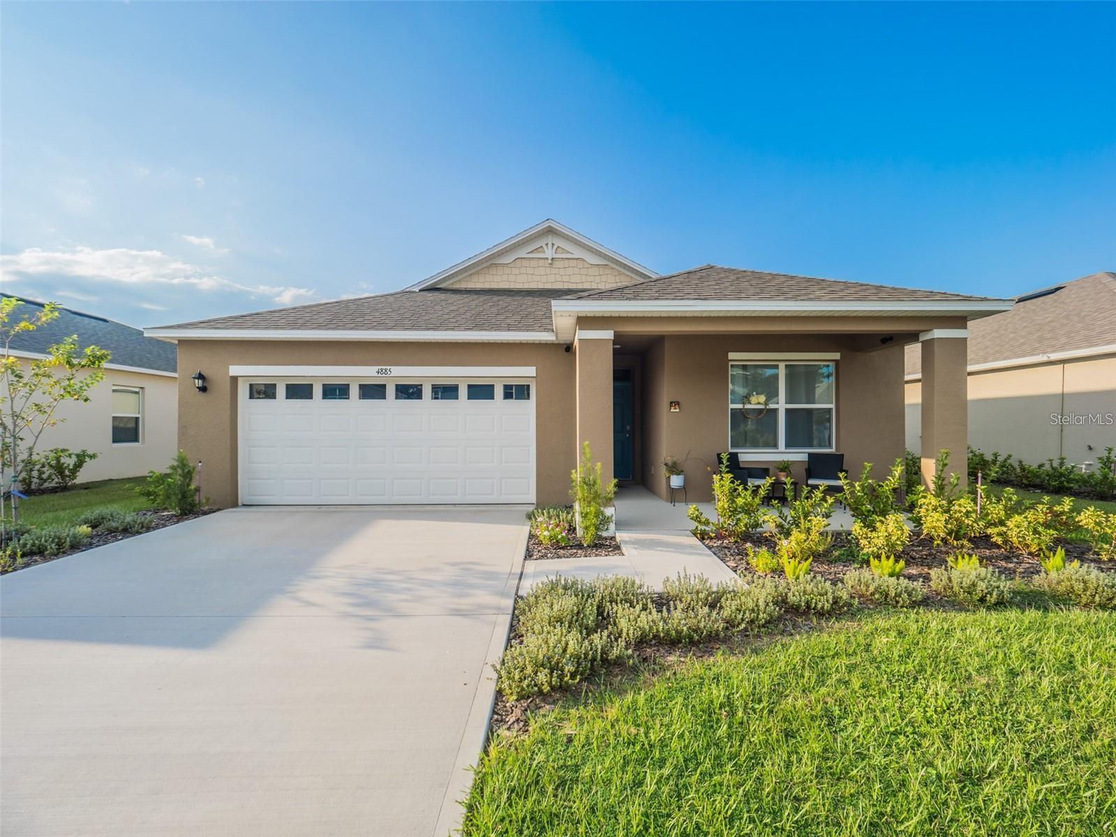 Beautiful home offering a peaceful view of a community pond and walking trail right behind your backyard, with no rear neighbors! Located just a few miles from Historic Downtown Mt. Dora, you'll enjoy easy access to charming shops and dining. The spacious open floor plan is perfect for modern living, featuring both a welcoming front porch and a back porch for outdoor relaxation. Inside, the home boasts elegant finishes, including granite countertops, 18" ceramic tile, 36" white cabinetry, stainless steel appliances, and stylish lighting. Smart home and security features are already in place, including a Ring video doorbell Pro 2, Blink cameras, a front door keyless lock, smart thermostat, and automated exterior lighting. Built with energy efficiency in mind, the home includes a 15 SEER AC system and dual-pane low-E windows. The community features a refreshing resort-style pool, playground, and an outdoor exercise area. Don't miss this perfect blend of convenience and tranquility!