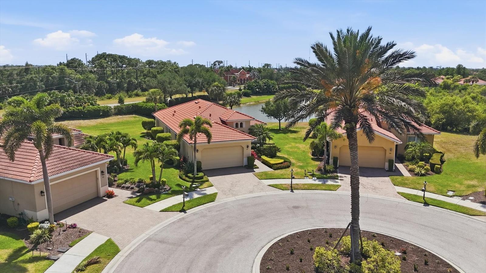 Don't miss out on your chance to own this SPECTACULAR HOME. Located in the PREMIER GOLF community of VENETIAN GOLF AND RIVER. Sitting on an EXTRA LARGE lot at the end of the Cul de Sac.  As you drive up, curb appeal is off the charts.  Pavered drive and sidewalk surrounded by tropical landscaping.  Arched entrance to patio and leaded glass front door.  Step inside to this IMMACULATE and well taken care of home. The popular FLORENCIA floor plan by WCI offers 3BD/2BA/2CG.  Open great floor plan. Absolutely GORGEOUS kitchen with rich wood cabinets, BEAUTIFUL GRANITE COUNTERS, STAINLESS STEEL APPLIANCES, STONE TILE BACK SPLASH, EXTRA RECESSED LIGHTS, and SOLAR LIGHT.  Kitchen looks out at the living area with Tray ceiling and cheery breakfast nook.  Step out on to the SPACIOUS lanai and enjoy the Peaceful and Serene LAKE VIEW.  80 feet of expansive lake front are yours to enjoy.  Extremely PRIVATE -no neighbors in sight. Protected by roll down HURRICANE SHUTTERS during a storm. No need to move furniture inside.  Extra pavered space for grill outside covered lanai. TILE flooring and CROWN MOLDING throughout main areas of home.  HIGH ceilings and lots of arches between rooms. Updated FANS AND FIXTURES.  Master bedroom with en suite bath that offers dual sinks, walk in shower, and soaking tub.  Guest bedrooms and bath at the other end of home for privacy.  Laundry room has wash sink and cabinets for storage.   Venetian Golf and River Club sits in an ideal location between Sarasota and Venice, close to all the various activities the Florida Lifestyle offers. Venice Downtown, Sarasota Downtown, multiple beaches including World Famous Siesta Key- voted one of the best beaches in the US. Kayaking, boating, fishing, and trail walks are just minutes away. Shopping, theatres, and restaurants-both casual and fine dining are right around the corner. And then sometimes you just want to stay at home- within the community that is. Venetian Golf offers everything you could want- Clubhouse, exercise room, tennis and pickleball courts, Resort style swimming pool and Tiki bar, Lap pool, and formal dining restaurant. Boardwalk nature walking trail through 70 acres of nature preserve park down to Myakka River. Lots of community activities and special event opportunities to meet your neighbors. Golf Membership is NOT mandatory but is available for the 18 hole Championship golf course. Come find your Florida Lifestyle today!!