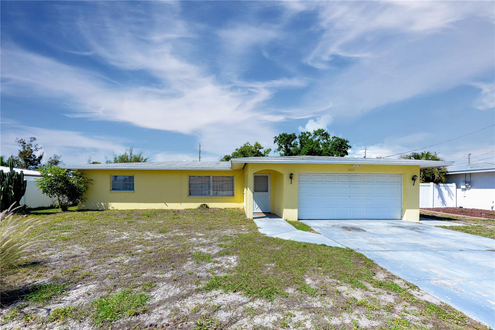 MOTIVATED SELLERS! PRICE IMPROVEMENT. Welcome to your slice of paradise in the sought-after Coral Shores community—where coastal charm meets everyday convenience. Smell the salt air and bask in the sun! Just 3.5 miles from the pristine shores of Anna Maria Island, this beautifully situated tropical 3-bedroom, 2-bath home invites you to experience the ultimate Florida lifestyle. Imagine starting your mornings with a gentle Gulf breeze and ending your days with breathtaking sunsets over powder-soft white sand beaches. Step inside to discover a thoughtfully designed layout, highlighted by a versatile Florida room—perfect as a sunlit retreat, home office, or entertainment space. Whether you're hosting guests or enjoying a quiet evening, this home effortlessly adapts to your lifestyle. New vinyl fencing adds to your privacy and an outdoor shower spicket on the side of the home allows you to rinse off after sun bathing, gardening, or just to cool off! Located near the renowned IMG Academy, this property is ideal for families and active individuals alike. Outdoor enthusiasts will appreciate easy access to premier golf at Manatee County Golf Course and Pinebrook Ironwood Golf Course. For recreation and relaxation, the expansive G. T. Bray Park offers something for everyone—featuring sports fields, an outdoor pool, walking trails, and even an amphitheater. Nature lovers will enjoy exploring the nearby New College Tidy Island Preserve, accessible by both land and water. Whether you're seeking a full-time residence, a seasonal retreat, or an investment opportunity, this Coral Shores gem delivers the perfect blend of tranquility, recreation, and coastal beauty.
Live where others vacation—your tropical dream home awaits.  **Ring Camera on premises above garage