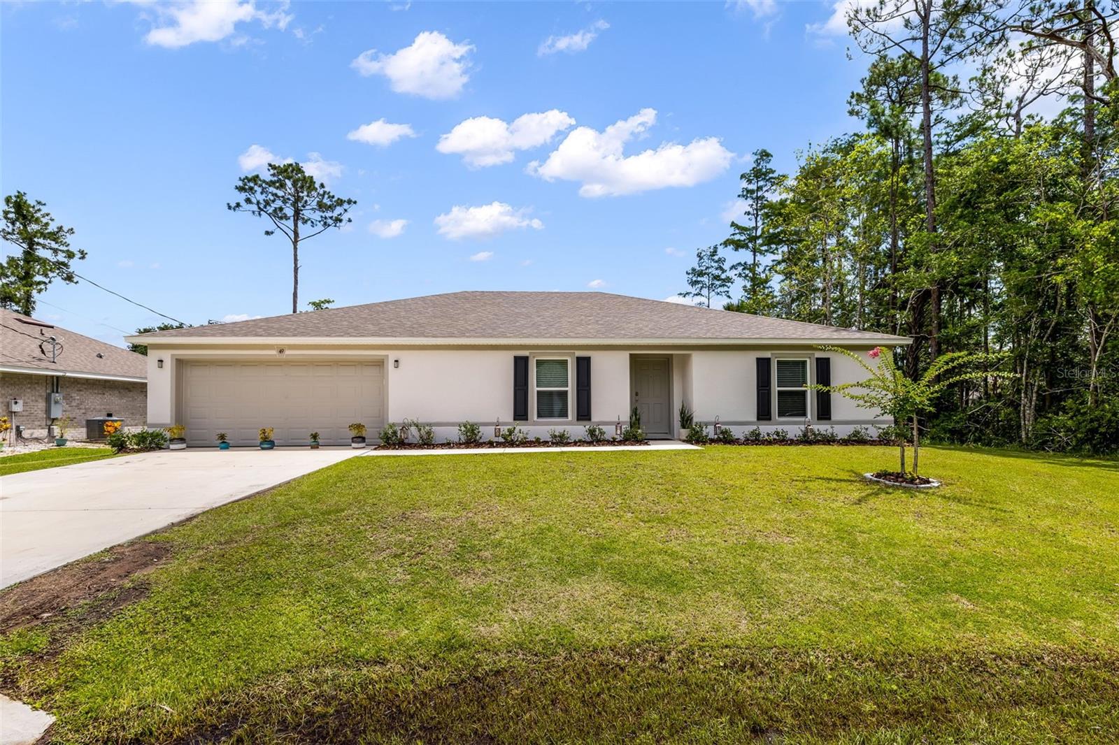 Newer construction without the wait! 
Built in 2024 by Holiday Builders, this concrete block home offers over 2,100 square feet of thoughtfully designed living space with four bedrooms plus a versatile den that can easily serve as a home office or fifth bedroom. The open floor plan seamlessly connects the living room, dining area, and kitchen, creating a comfortable and functional space for everyday living and entertaining.
A split bedroom floor plan provides added privacy, while the dedicated laundry room adds convenience and extra functionality. Step outside to a spacious backyard featuring a fire pit area, perfect for relaxing and enjoying Florida evenings. 
The sellers have loved calling this home their own, but relocation has them motivated and ready for its next owner. Conveniently located near beautiful beaches, shopping, restaurants, historic downtown St. Augustine, and Daytona Beach, this home offers space, comfort, and easy access to some of Northeast Florida’s best destinations.