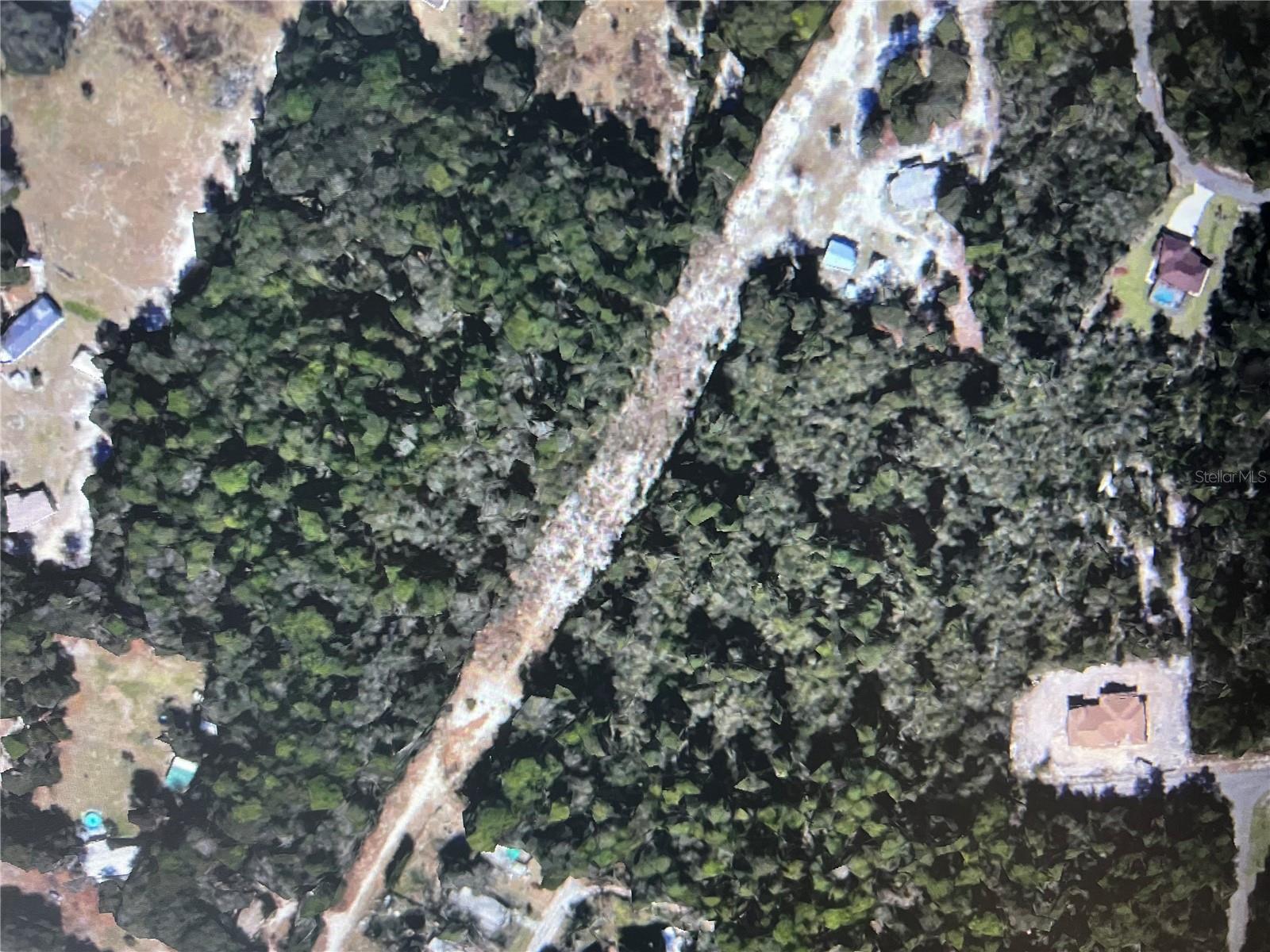 12.24Vacant land – go and show. No appointment required. Property has no physical address or signage. Use GPS to SE 122nd Lane Rd, Ocklawaha and verify location with parcel map (Parcel #4853-143-000). Recommend using aerial/map overlay (Marion County GIS) to confirm boundaries. Unimproved/lime rock roads—use caution. Wooded acres that can be divided into 9 lots according to Marion County Planning Dept