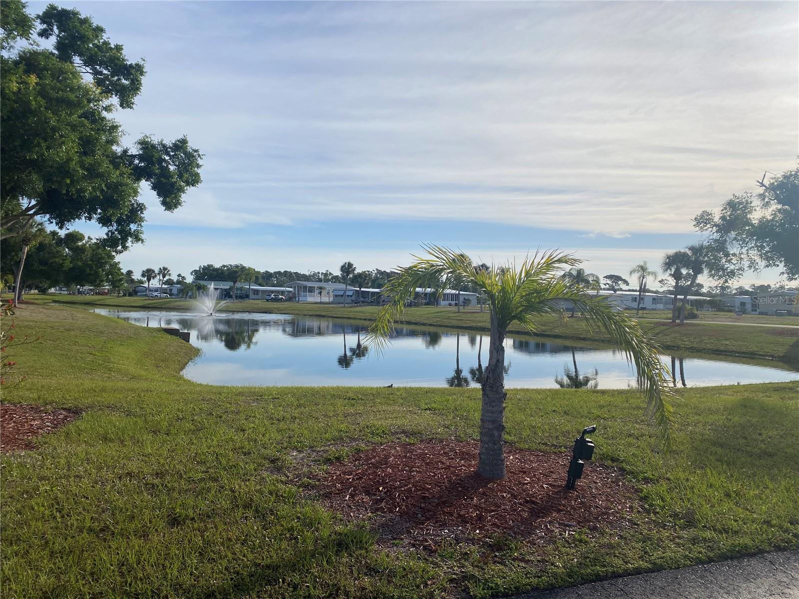 Vacant Lot.  This is a prime lake corner lot on a quiet La Casa Street with glorious views overlooking the length of Lake Encorvar.  The lot is located near our Club House and amenities. La Casa is a quiet senior community, just for persons 55 and up, located in North Port, Florida in Sarasota County. There are 974 homes nestled among a variety of native trees with spacious common grounds surrounding our eight lakes. Our lots average a generous 60' by 80'. The ultimate lifestyle on Florida’s Gulf Coast is located between Sarasota and Fort Myers with boat access to the Gulf of Mexico. La Casa is an impeccably maintained isolated and self-contained oasis. It is convenient for shopping, sightseeing, golfing, fishing and boating, as well as all the culture and elegance the Southwest Florida area is noted for. Residents and visitors enjoy the warmth of Southwest Florida winters in a relaxed and unhurried environment far removed from the hustle of Florida’s east coast. You’ll be surrounded by hundreds of palms reaching for the sky and beautiful mature lush landscaping which demonstrates the utmost level of care our property receives from residents and management
La Casa may have the best pools in the area. An extremely large, 40 X 60-foot swimming pool is our crown jewel and is kept at a perfect 87 degrees. Our smaller 20 x 40 pool is quietly nestled between the clubhouse and the Activity Building. Both pools have adjacent hot tubs which are perfect for soaking muscles that are tired from golfing or tennis. Wireless Internet (WiFi) is available at the Clubhouse, Activity Building and Recreation Hall area where these pools & spas are located, so you can catch some rays while you catch up on your email! Sound enticing?  La Casa is a friendly, family community. You will be away from the hustle and bustle except when you want to be part of it. When you leave our gates, North Port is only 1.5 miles from the city center, where you will find every kind of retail store and service you could need.

Come for a visit or make La Casa your home!