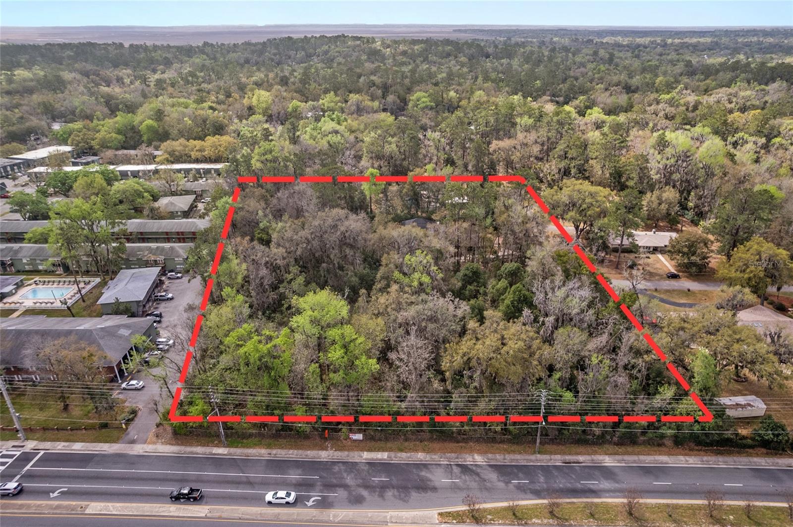 Rare ±1.996-acre infill development opportunity in Gainesville’s established Kirkwood neighborhood along SW 16th Avenue. Centrally located just minutes from the University of Florida, UF Health Shands Hospital, the VA Medical Center, and Downtown Gainesville. Based on city planning guidance, the site has the potential to be subdivided into multiple residential lots for new single-family homes. Nearby home sales demonstrate strong demand with recent properties selling for approximately $365,000, $321,000, and $328,000 in the surrounding area. Close to everyday amenities including CVS, Aldi, 7 Brew Coffee, PK Yonge, and numerous restaurants and services. Excellent opportunity for builders, developers, or investors seeking well-located residential land in Gainesville’s urban core.