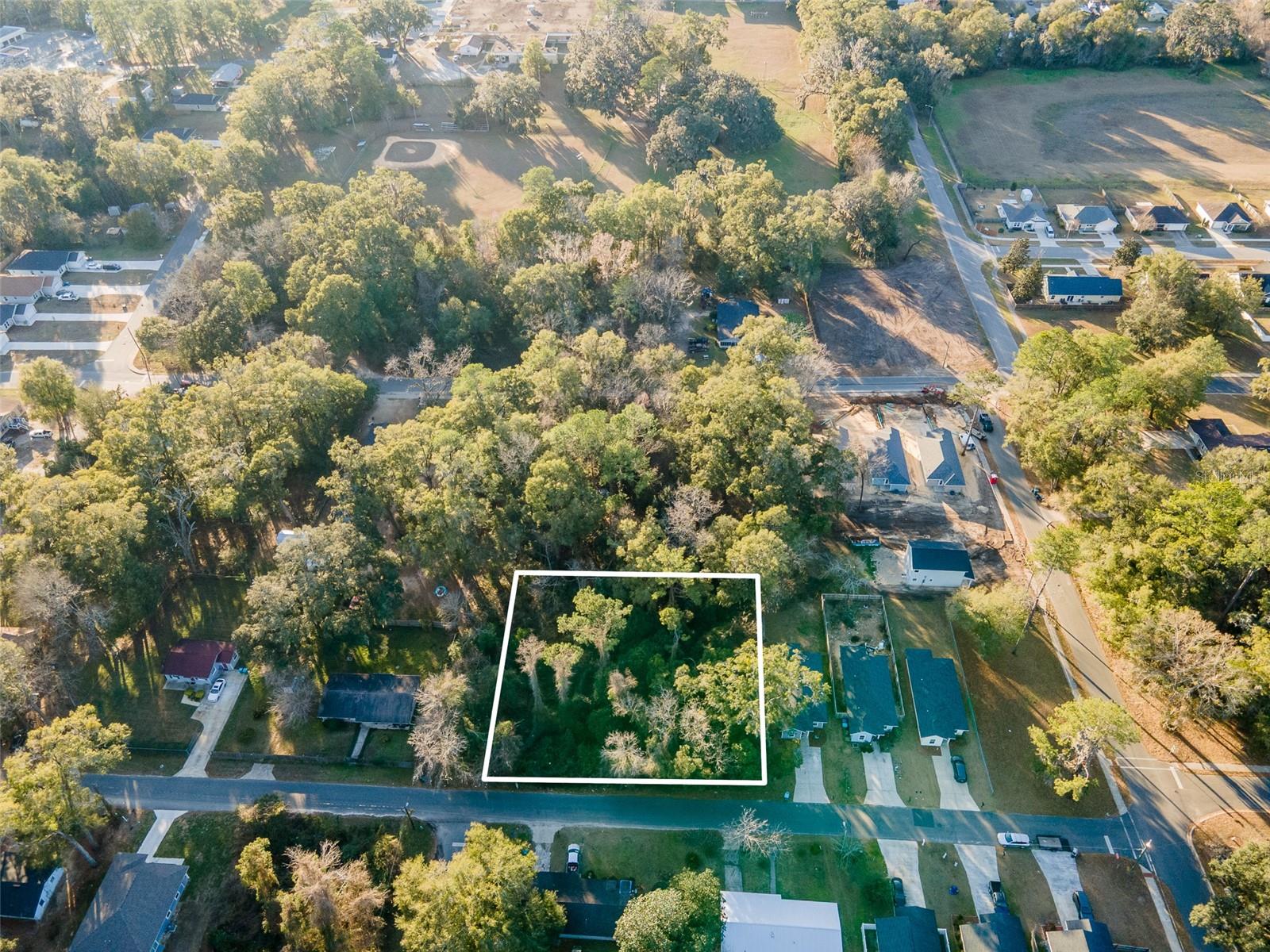 Vacant land ripe for residential development right near downtown Alachua close to Alachua Elementary School. Other new homes are under construction nearby. Two additional tax parcels are part of the listing for a total of approximately 1.1 acres and at least 7 buildable lots. 03276-000-000 and 03276-001-000. Open builder.