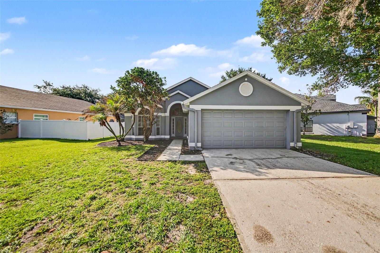 This 3-bedroom, 2-bathroom single-story home offers a durable and functional foundation, featuring an attached 2-car garage and a completely carpet-free interior with tile flooring throughout the entire home. The layout begins with a spacious living room and dining room combo at the front, perfect for versatile furniture arrangements and entertaining. The kitchen is already updated with premium granite countertops and includes a full suite of well-maintained appliances in good working condition. While the property needs some TLC and, its high-value features—like the stone counters and easy-to-maintain tile—make it an excellent opportunity for a buyer looking to build quick equity through cosmetic updates.