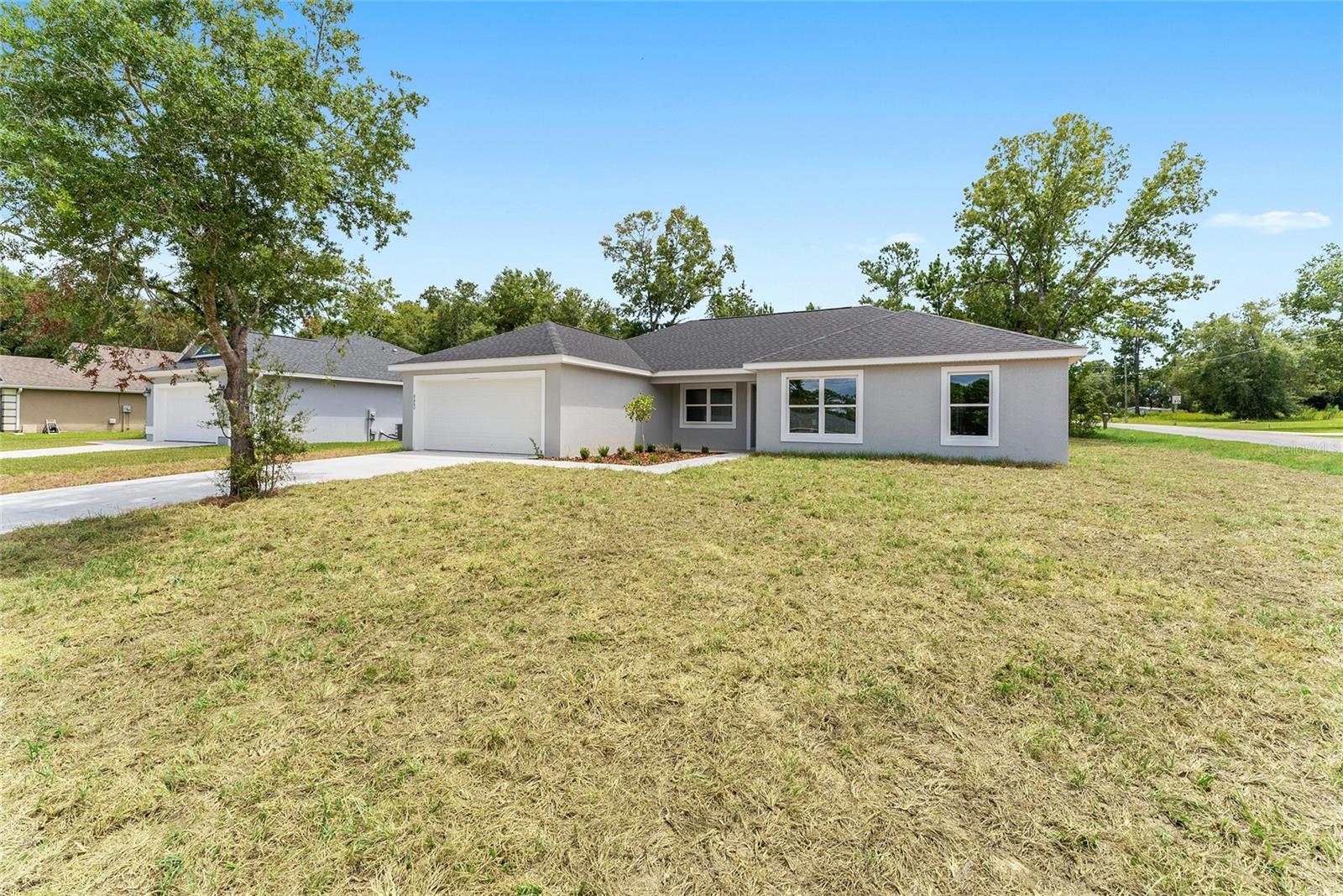 Beautiful new construction concrete block and stucco 3 bedroom 2 bath home with den and a 2 car attached garage. Luxury vinyl flooring through out, ceiling fans. covered lanai, granite counters and breakfast island seating, additional dining area and open great room plan. Master en-suite bathroom with walk in closet, dual sinks and granite counters. Well and septic NO HOA fees. Appliance package includes range, refrigerator and dishwasher.