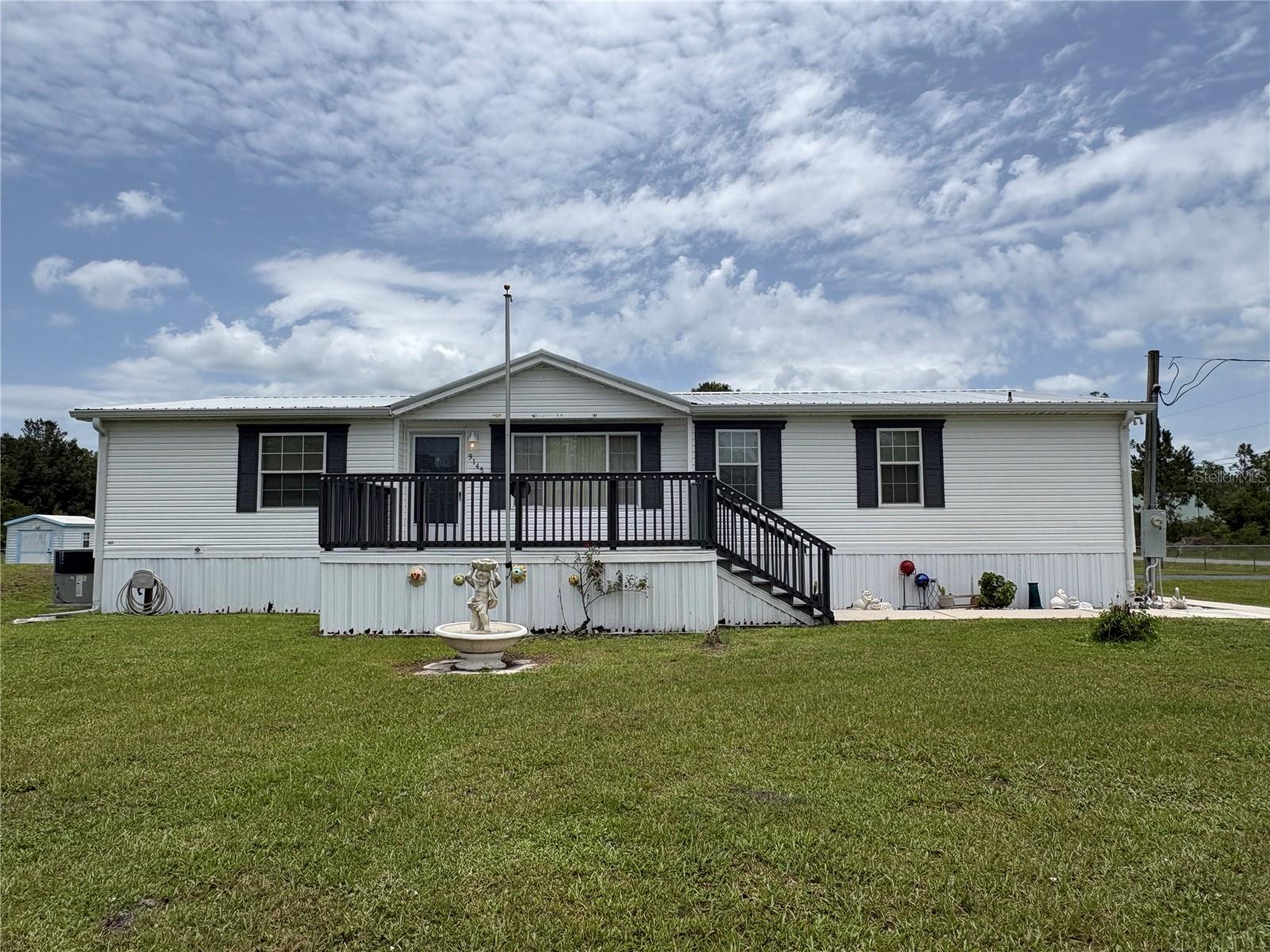 Discover this 3-bedroom, 2-bath mobile home in St. Cloud, situated on a spacious 1-acre corner lot. Bring your boats, RVs, work equipment, or weekend toys—the impressive 30' x 40' detached garage offers endless possibilities for a workshop, storage, or hobby space. Enjoy the privacy, space, and freedom you've been looking for, all while staying close to everything St. Cloud has to offer.