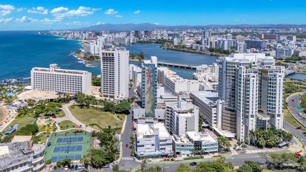 Multi-Family and Commercial Corner Property

51 Muñoz Rivera Ave., corner of Los Rosales St. and Las Palmeras St., San Juan, P.R. 00901

Lot Size: 1,639.04 sq. mts.
Total Built Area: 26,254 sq. ft.
Commercial Retail Spaces: 8
Residential Units: 26
Parking Spaces: 18
Zoning: CT-1, Commercial Tourist
Year Built: 1955
Type: Mixed-use Commercial / Residential

Corner Property Facing the Caribe Hilton Hotel

This property spanning almost a block, consists of two corner buildings totaling 26 apartments, 8 commercial units, 18 parking spaces, and two rooftops with sweeping views. It is the last available mixed-use property of its kind in the Caribe Hilton corridor—an area known for its iconic destinations, direct waterfront access, and steady visitor traffic.

With a 1,639-square-meter lot and 26,254 square feet of built area, this corner parcel with triple frontage presents an exceptional investment opportunity in one of San Juan’s most strategic and high-demand locations.

A Coveted Location with Proximity to some of San Juan’s Iconic Sites

Located along San Juan’s scenic coastal gateway—just minutes from the cruise ship port, historic Old San Juan, upscale condominiums, luxury beachfront hotels, the Convention District, El Distrito T-Mobile, marinas, and the regional private aviation airport—this property is ideally positioned to attract both locals and tourists.

Directly facing the iconic Caribe Hilton, the legendary Normandie Hotel, and Puerto Rico’s Supreme Court, the property boasts a location that is both strategic and symbolic. Just steps from El Escambrón Beach—known for its calm, reef-protected waters ideal for swimming, snorkeling, and scuba diving—and a short walk from Luis Muñoz Rivera Park, a lush 12-acre green space.

Positioned between Old San Juan and Condado—Puerto Rico’s most emblematic districts—this site serves as a threshold between the timeless character of the old city and the contemporary sophistication of San Juan’s luxury district.

Zoning: Commercial Tourist (CT-1)

CT-1 (Comercial Turístico 1) zoning allows for a broad range of tourism, hospitality, and commercial uses—such as boutique hotels, short-term rentals, restaurants, or mixed-use redevelopment—especially in high-traffic, visitor-oriented areas like this dynamic coastal corridor.

Location, location, location—at its finest.
Opportunities like this do not last. Be the one to claim it.