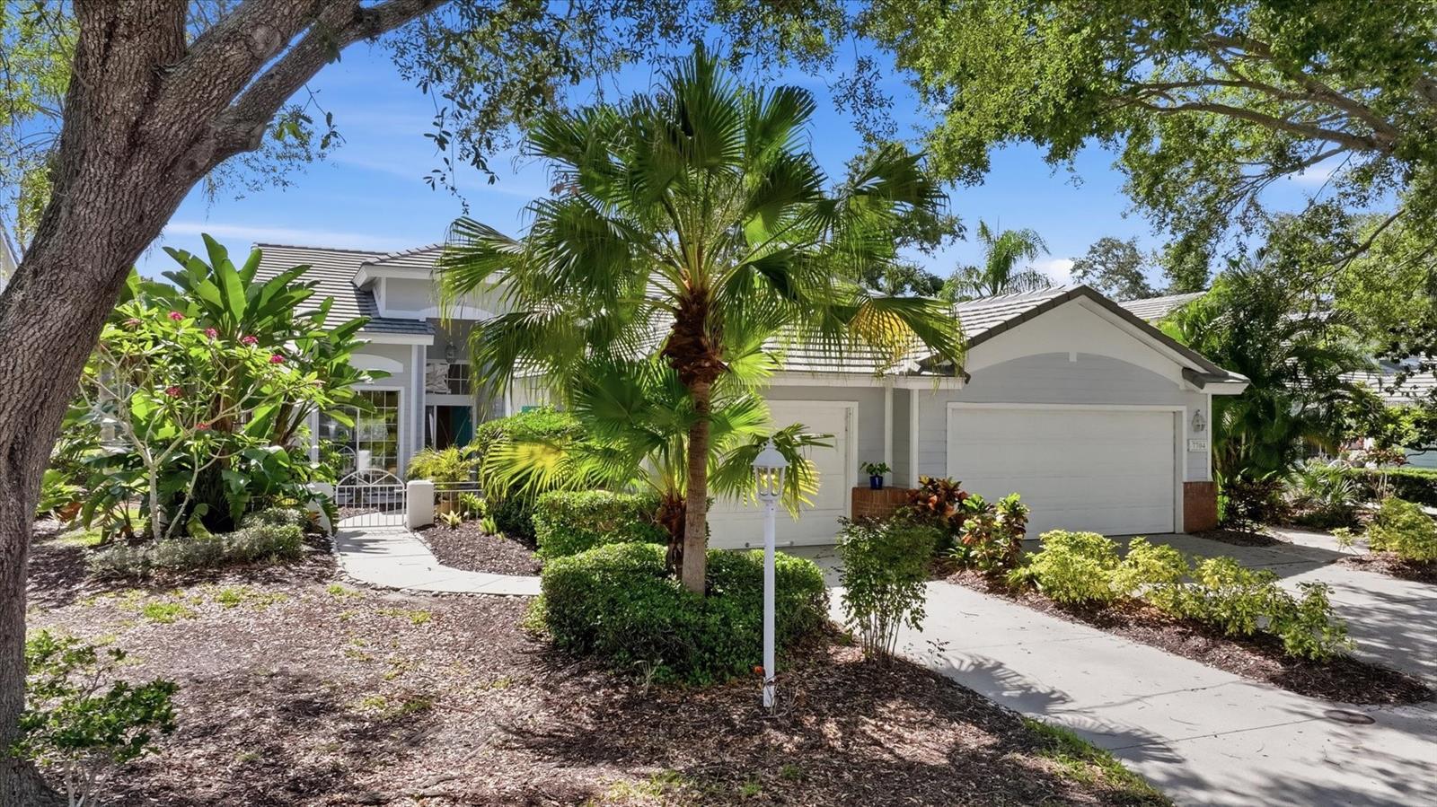 Welcome to University Park Country Club! With its mature landscaping and sprawling natural beauty, University Park is one of the premier master-planned communities in the Sarasota area. Behind the secured, staffed entrance is an award-winning, resident-owned community featuring 27 holes of four-star rated golf, eleven lighted Har-Tru tennis courts, four pickleball courts, a fitness center, croquet, miles of tree-lined streets for walking or biking, and first-class dining. Residents also enjoy numerous social activities and clubs designed to fit a wide variety of interests.

Located only four miles from downtown Sarasota and its vibrant arts community, museums, shopping, dining, and world-class healthcare, University Park offers a peaceful oasis while remaining close to everything Sarasota has to offer. It is also just a short 15-minute drive to some of America’s finest beaches, outstanding outdoor recreation areas including the internationally renowned Nathan Benderson Park, the famed Ringling Museum, boating opportunities, and the acclaimed St. Armands Circle.

From the moment you walk in, you will be captivated by the gorgeous lake views. The enclosed lanai will quickly become your favorite place to relax, enjoy the sunshine, and watch the abundant wildlife. High ceilings throughout the villa create an open and spacious feeling. The large primary suite features a walk-in closet and oversized vanity, while the guest suite is conveniently located on the opposite side of the home, providing privacy for everyone.

This maintenance-free community includes approximately 150 TV channels and WiFi service. The community pool is just a few steps away and is large enough for lap swimming and water exercise. Recently installed ROOF (2021) and AC system (2020) provide additional peace of mind.