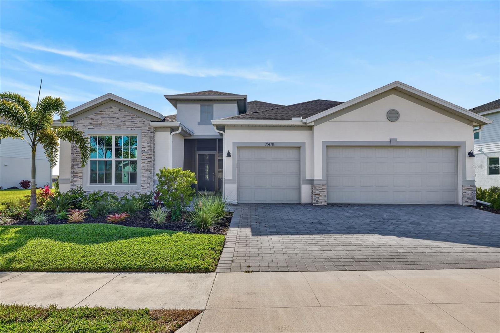 Welcome to your new home in Tucker's Cove! Your tour begins at a screened-in covered entryway that opens into a wide, sun-filled foyer, immediately showcasing the grand scale of this Palmetto floor plan. This floor plan offers 3 bedrooms, a den, 3 bathrooms and a 3-car garage with upgraded epoxy flooring. As you walk further into the home, the space opens up into a magnificent great room, where high ceilings, upgraded paint schemes and high-end finishes set a tone of sophisticated comfort. To your left, the gourmet kitchen features an oversized quartz island - seamlessly integrated with sleek cabinetry, an upgraded gasless cooktop, upgraded dishwasher, a 3/4 hp garbage disposal, ceiling pendants, and a Culligan water filtration system throughout. From the kitchen, the layout flows seamlessly into the living room, a light-filled space where the open-concept design truly shines. Your eyes are immediately drawn upward to the upgraded wood tray ceiling, which adds a layer of architectural depth to the space. Step through your expansive glass sliders and onto your screened-in lanai that serves as your own private backyard resort. This area is lined with a custom-designed pool with added stainless steel rails, an integrated spa and an outdoor kitchen. This oasis acts as an extension of your living space, providing a tranquil space to enjoy the fresh air and panoramic views of the lake and amenity center! Retreating back inside, step into the Owner’s Suite, a private sanctuary that also has sliders for lanai access. This wing of the home features walk-in closets and a spa-style bathroom boasting dual vanities and a glass-enclosed walk-in shower. On the opposite side of the residence, the guest wing offers two additional bedrooms, 2 bathrooms (one being an en-suite in the guest bedroom) and a versatile den—ensuring ample privacy for everyone residing. This side of the home is also where you have your garage access - connected by an indoor laundry room which consists of a laundry sink and updated LG washer/ dryer. Every inch of this home has been thoughtfully upgraded to offer a seamless blend of comfort, and modern living. Even the window treatments are custom and operate automatically with a remote control! The vibrant community of Tuckers Cove is designed to feel like a permanent vacation and is the only waterpark-inspired community in Babcock. Amenities include a winding lazy river, water slides, a Luau Beach area and the Shipwreck Tavern—a ship-themed bar and grill that is perfect for meeting neighbors for a sunset cocktail or a casual poolside meal. The adventure continues with an array of world-class wellness and recreation amenities, including a state-of-the-art fitness center, a resort-inspired pool/ spa, a splash park, pickleball, tennis, and basketball courts, walking trails, a neighborhood dog park AND MORE. Come check out why this is one of the region's most exciting new communities!