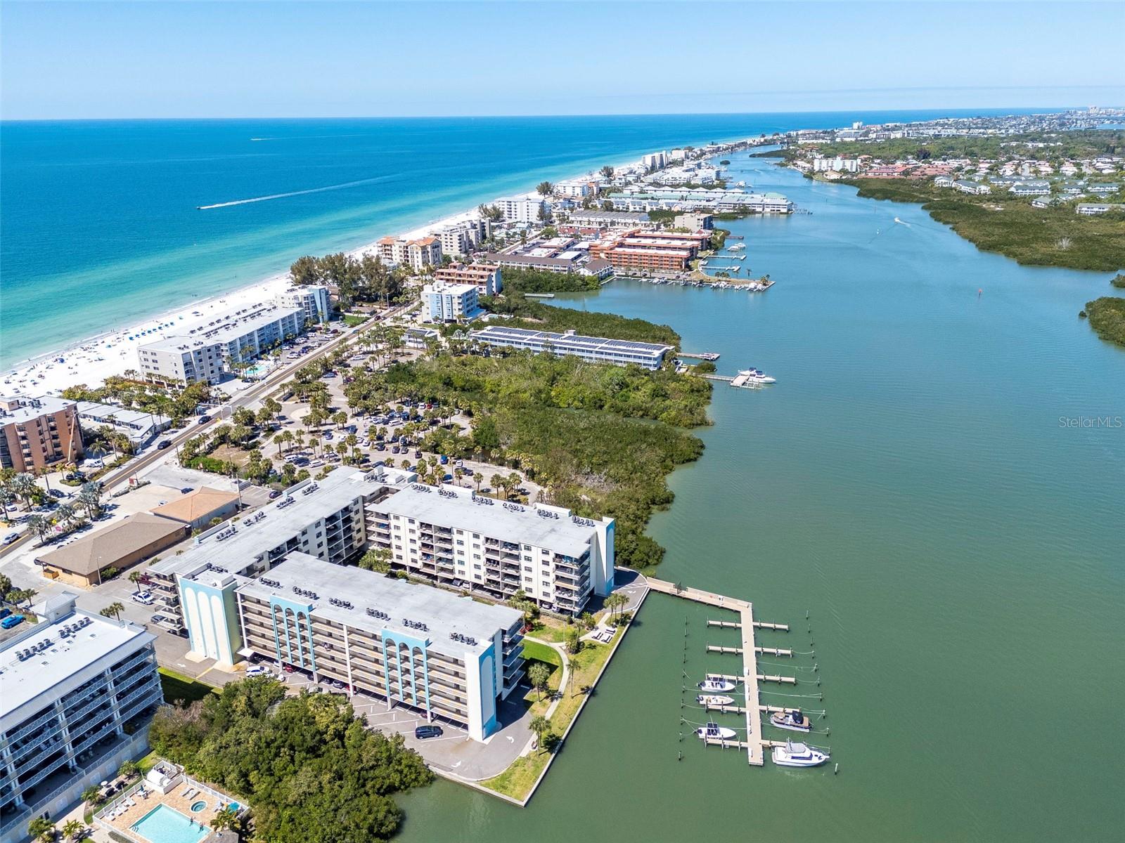 **Reduced **
IMMACULATE & Fully Furnished!! Just bring your toothbrush! 
Very well kept Intracoastal Waterfront Condo END UNIT offering 2 Bedrooms, 2 Bathrooms, in beautiful and desireable Golden Shores Condo Community, immediately across from Indian Shores Beach. Ready for your immediate occupancy! If you are looking for a 2nd home perhaps also to rent out, you can rent this unit out immediately with a 30 day minimum timeline. Pets welcome. All ages welcome! Have a boat ? 20 NEWER & Updated Boat Slips on a first come first serve basis. The unit includes a washer & dryer for your convenience. You will love the wood-look ceramic tile throughout the unit! MAJOR feature - is the LARGE 10 x 21 covered Lanai with SUPER Intracoastal Waterviews, Pool and Courtyard! LOTS of new:  AC 2020, Roof 2023, Dishwasher 2024, Refrigerator 2023, Microwave 2013, Washer & Dryer 2023, Building was painted 2019, 
Some amenities include: ****Great Financial Reserves, Structural Integrity Reserve Study - Milestone Inspection Report Completed, Onsite Manager, 2 Secured Entries to the building, Grills and picnic tables by the Pool area, Assigned Parking under the Building, Heated Pool and Hot Tub, Fishing Pier, meeting room and 2 Elevators, as well as a Storage Room. VERY Social community!!
SUPER location with walking distance to fine dining, shops, and so much more! This community is adjacent to the Tiki Gardens Indian Shores County Park. Unit being sold as-is for sellers convenience. Please enjoy the Virtual Tour~