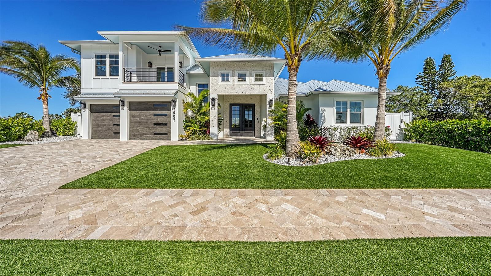 Pre-Construction. To be built. *Vista Model* Community Award winner in Parade of Homes. Palma Sola Grande is an Exclusive Gated Community in West Bradenton featuring 16 new construction homes overlooking Palma Sola Bay. *Pictures are from a completed sold Vista model*. The Vista Model is a coastal contemporary two-story home with a spacious great room, gourmet kitchen, and private primary suite as well as a separate private suite on second floor with a terrace that has views of Palma Sola Bay. All plans are open-concept and built to entertain, with brilliant natural light pouring into the expansive living space and shining throughout the home. The gourmet kitchen is perfect for cooking and entertaining, featuring Thermador stainless-steel high-end appliances and stunning quartz countertops. The private primary suite features a roomy walk-in closet, ensuite bathroom featuring a freestanding soaking tub and a spacious walk-in shower with glass enclosure and sleek finishes. Other features include an oversized two car garage, metal roof system, and hurricane impact-resistant windows and doors.The front yard and the fenced backyard feature lush low maintenance tropical landscaping. The backyard is a tropical oasis featuring a custom luxury heated resort-style saltwater pool and spa with a complete outdoor kitchen. You will love the ideal location with close proximity to the Gulf Beaches of Anna Maria Island, IMG Academy and Golf Course, Robinson Preserve, Historic DeSoto National Park, downtown Bradenton, St. Pete, the cultural and culinary arts of Sarasota, shopping, stores, restaurants, and medical facilities. Keep your boat at one of several nearby Marinas. Walk or ride bikes to the Robinson Preserve, a 682-acre nature preserve offering trails, kayak launches & a picnic area. This is the ultimate Florida lifestyle location! Contact us today to set up a private tour and experience the beauty and lifestyle firsthand before the community sells out! Price does not include lot premium or custom pool.