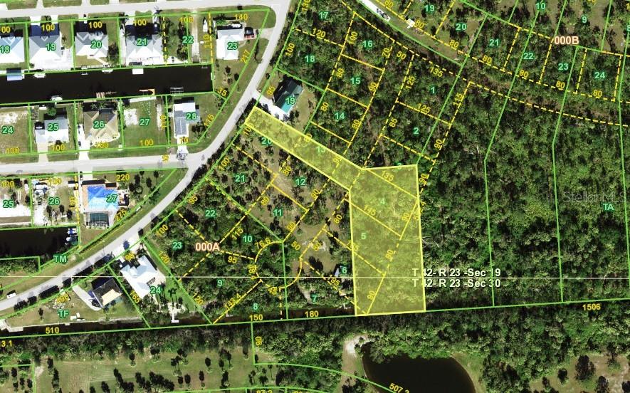 Discover the perfect setting for your waterfront dream home on this exceptional 1.35-acre parcel in the desirable waterfront community of Pirate Harbor. Public utilities available. Boasting approximately 150 feet of saltwater canal frontage, this property offers quick boating access to open water and some of the area’s best fishing right from your backyard. The canal is teeming with game fish and mullet, making it ideal for boating enthusiasts, kayakers, canoe lovers, and flats boats alike. Conveniently positioned just off US-41 (Tamiami Trail) in the desirable Burnt Store Lakes/Pirate Harbor area, the property combines a tranquil, nature-focused setting with excellent access to everyday amenities. To the south, Burnt Store Marina offers waterfront dining, golf, boating, and social activities, along with quick connections to Cape Coral and Fort Myers for expanded shopping, dining, and entertainment. To the north, downtown Punta Gorda, Port Charlotte, and North Port provide additional conveniences, including Harborwalk, Fishermen’s Village, medical facilities, parks, shopping centers, and a wide array of restaurants and services along the US-41 corridor. Residents may also enjoy access to Burnt Store Lakes community amenities such as a park, picnic areas, and a kayak/canoe launch with entry to Charlotte Harbor. Grocery stores, schools, healthcare, and daily essentials are all within a short drive, offering an ideal balance of tranquility and accessibility.   ALSO - An incredible opportunity awaits, as the neighboring lots located at 24413 Jean La Fitte Blvd and 24511 Yacht Club Blvd are also available for purchase. Combined, all three connected properties total approximately 6 acres, creating a rare chance to own an expansive waterfront estate with endless possibilities.
