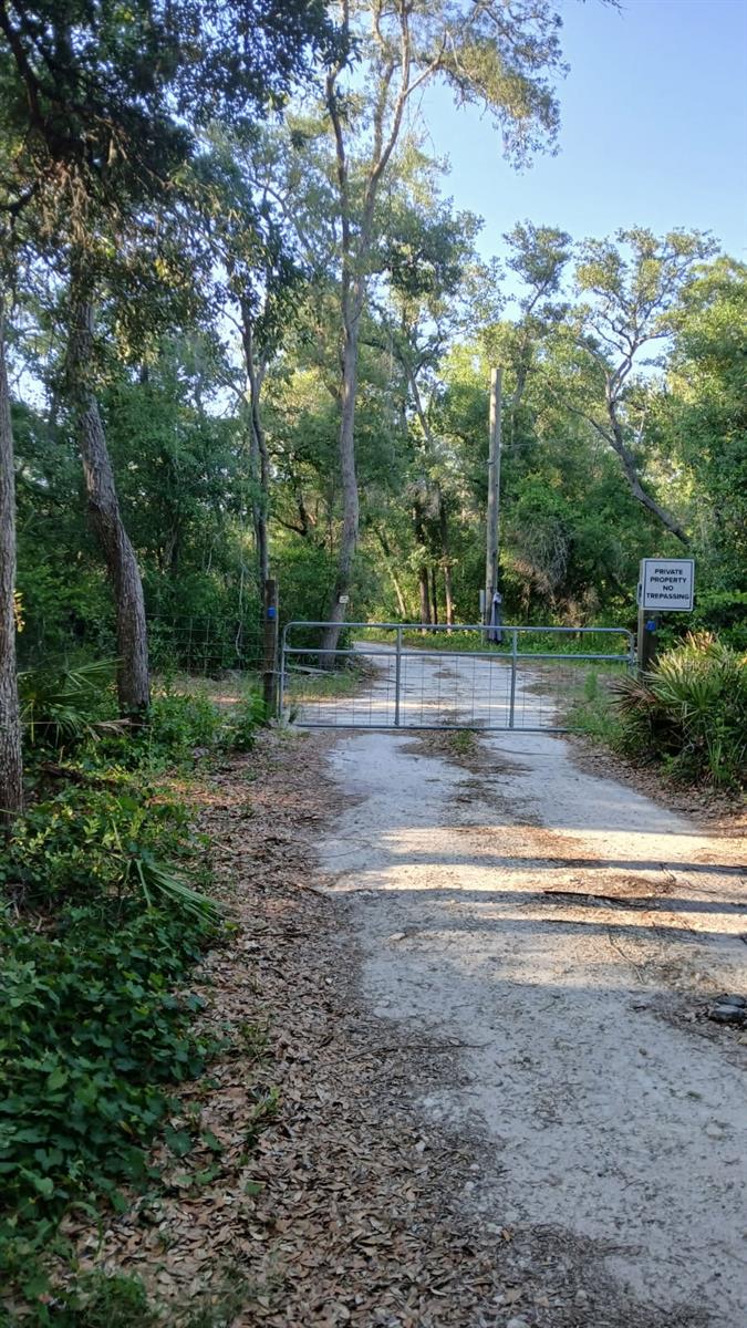 Discover the perfect blend of privacy and opportunity with this 10.25-acre homesite, tucked away yet easily accessible via a deeded easement. This property is ready for your dream build, featuring a 40x60 prepared house pad, well, septic (sized for a 4-bedroom home), and electric pole all installed in 2023. Improvements also include a storage building and a carport/pole barn also installed in 2023, offering immediate functionality and convenience.
Enjoy peaceful, natural surroundings with the added charm of a neighboring deer farm, where deer are often seen and can be fed right from your hand. Whether you’re looking to build now or invest for the future, this secluded property offers a rare combination of infrastructure, acreage, and serene country living.
