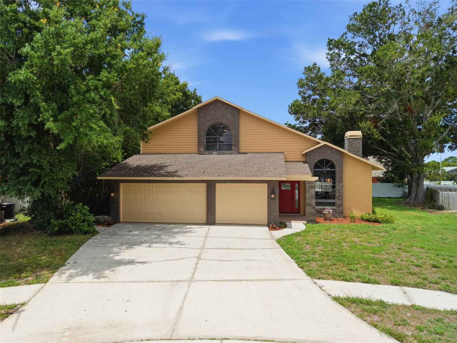 With nearly 2900 square feet of living space on .28 acres, this home combines exceptional space and extensive recent improvements. Updates include: roof (06/2024), HVAC systems (2025 & 2022), water heater (2026), garage doors, siding/exterior paint, exterior doors/french doors, patio windows, pool screen, rescreened windows, garage/porch/patio/pool deck paint, interior paint, interior doors/millwork, luxury vinyl plank flooring, carpet, 5 1/4" baseboards, stone fireplace facade, custom kitchen cabinets/solid surface tops/tumbled travertine backsplash/workstation sink, new disposal, new dishwasher, bathroom vanities/quartz tops/undermount sinks/shower tile, ceiling fans throughout, and led lighting,  Built in 1987, the home features soaring ceilings, expansive living areas, and a flexible floor plan designed for both everyday living and entertaining. The private owner's wing includes a walk-in closet, and a beautifully remodeled primary bathroom with an oversized walk-in shower and inviting garden tub. The second floor has two additional bedrooms, a bathroom with dual sinks, and an open loft overlooking the main living area. A separate fourth bedroom with connecting third full bath is located on the main floor and could also serve as a dedicated home office or in-law suite. Outside, the property is centered around Florida pool side living with an expansive beautifully treed lot nestled in a quiet cul-de-sac. Additional features include an oversized three-bay garage. 

*Prior sale 12/2025 was a partial owner/investor buy out. This home was purchased 08/2014 by original current owner, and investor improvements were completed in 2025 and 2026. See deeds for verification.
