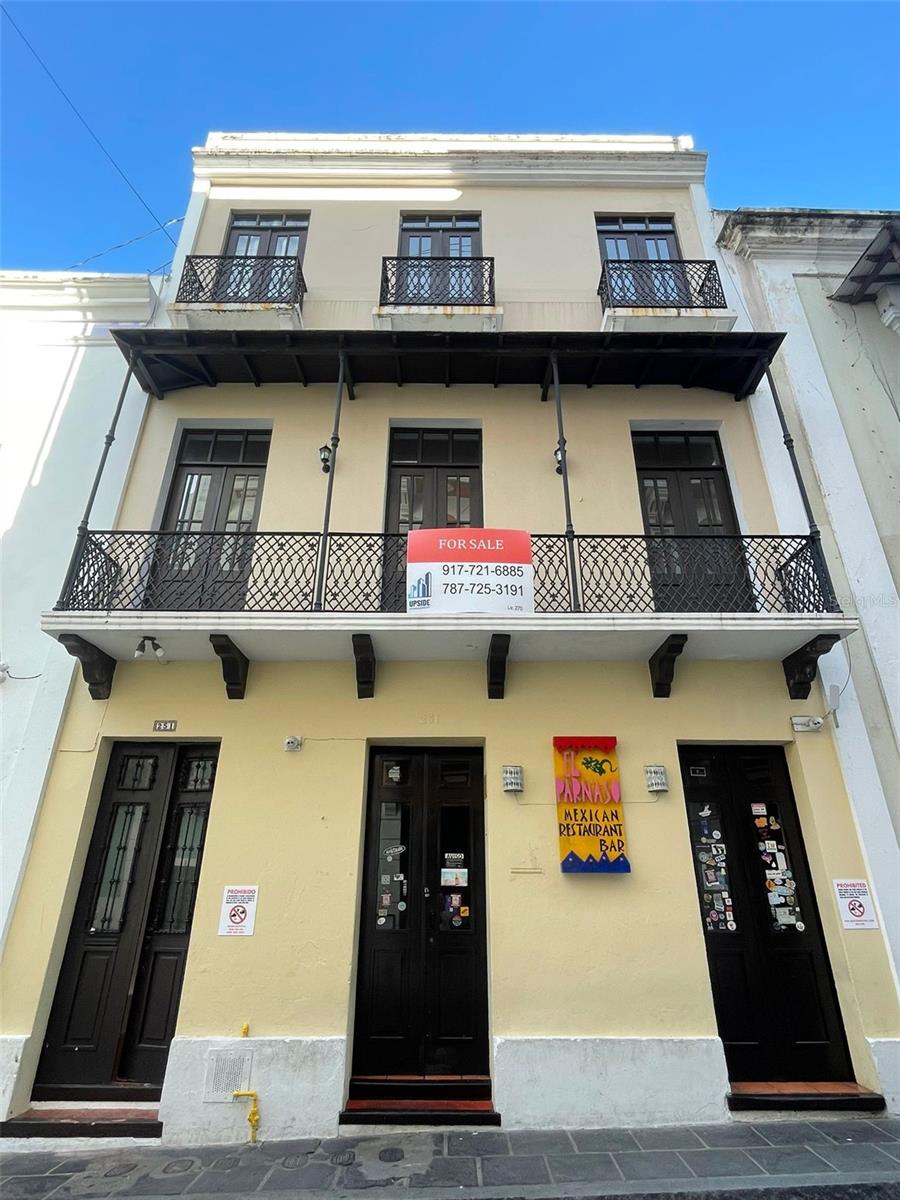 Majestic Income Producing Residence Next To ‘Umbrella’ Street This stunning three-story, mixed-use building is located in the highly coveted and pedestrian-only alfresco part of historic Cristo Street. The property features two, fully remodeled whole-floor residential units with high ceilings that are currently rented out on a short-term basis providing immediate income. The first floor also contains a well-known 30 year old restaurant and an additional space that can provide even more income potential. The property can also be easily converted into an owner’s residence with income producing tenants that fund the Caribbean lifestyle. Contact us today to schedule a viewing!