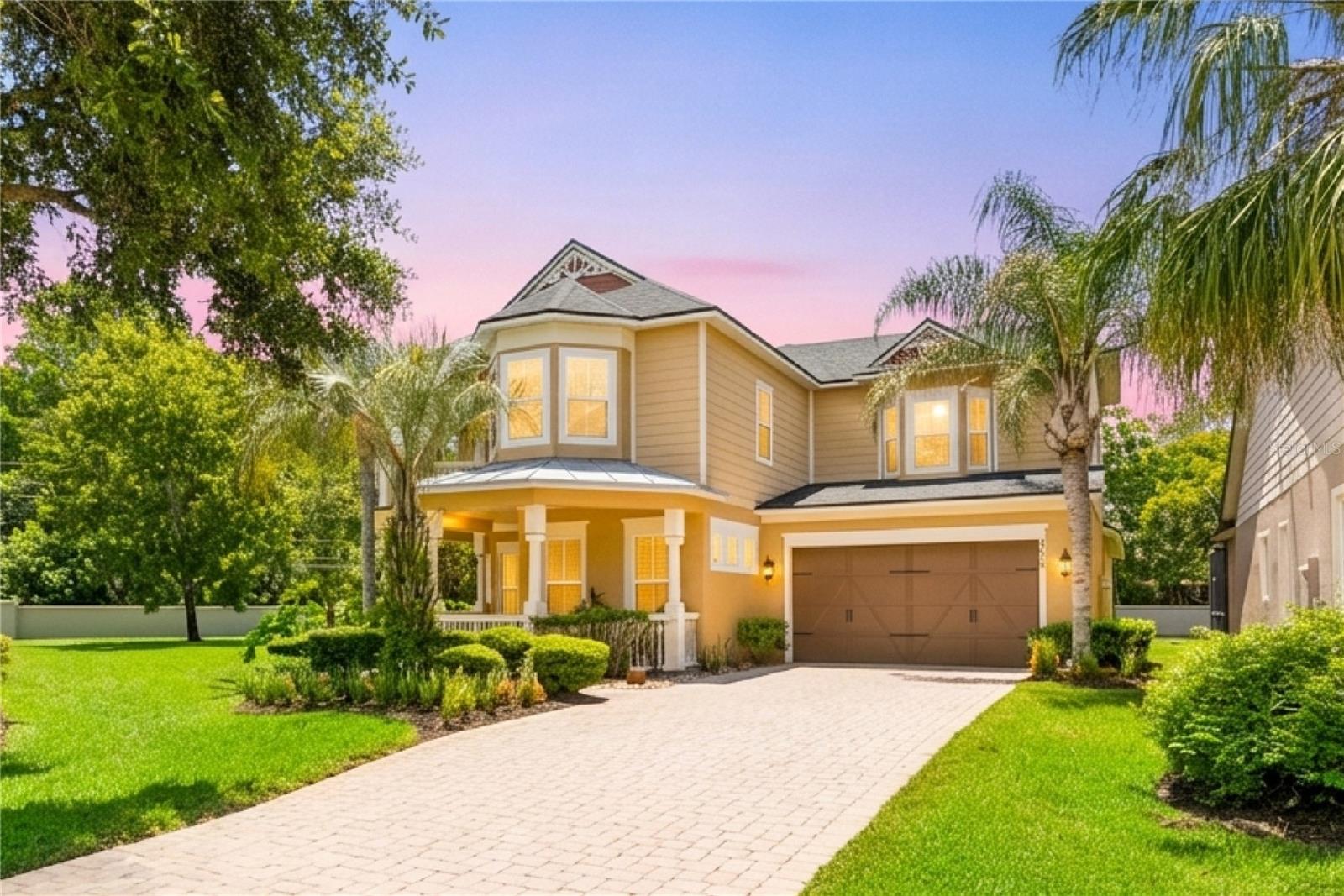 Welcome to Banyan Pointe — An exclusive, quaint, gated enclave of just 33 homes, crafted with timeless Key West inspired character that sets it apart from every other community in the area. This elegant home on a cul-de-sac features 5 bedrooms, 4 full baths, a theatre/media room in 4,154 sq. ft. of luxury living space, complete with an oversized driveway lined with vibrant, manicured landscaping and colorful flowers that draw you naturally toward a covered front porch. The moment you enter, you’re greeted by a soaring double-height foyer, cathedral ceiling and a bright, open-concept floor plan featuring elegant finishes, brand-new exterior and interior paint, spacious living areas, and seamless indoor-outdoor flow—perfect for both everyday living and entertaining. Major updates provide peace of mind, including a New Roof (2021), HVAC systems (2025 and 2026), Water Heater (2026), and Dryer (2026). The home has open-concept living and dining rooms that greet you with generous proportions and natural light, featuring trey ceilings and gorgeous crown molding that flow effortlessly into a kitchen that is nothing short of the heart of the home. The chef’s-inspired gourmet kitchen is truly the center piece – featuring a commanding oversized island, surrounded by soaring 42-inch-tall cherry cabinetry, stainless steel appliances, granite countertops, backsplash, and a walk-in pantry that will delight anyone who loves to cook, entertain, or simply stay organized. By the kitchen, a dedicated bar with custom cabinetry and backsplash leads gracefully through an elegant arch into the formal dining room, foyer and to the living room. As the day winds down, retreat into a luxurious oversized Primary Suite with high tray ceiling designed with every comfort in mind. It has two separate his-and-her walk-in closets, featuring walk-in double showers, a large soaking bathtub; his-and-her dual vanities adorned with a wall-to-ceiling mirror and has a generous linen closet. Four additional generously sized bedrooms and full bathrooms with modern showers throughout provide space and privacy for every member of the household. You will adore a cozy, open-air balcony on the second floor overlooking the beautifully manicured grounds. A versatile bedroom just off the main entry — with elegant French doors and a closet — adapts beautifully to whatever your life requires: a bedroom, a dedicated guest suite, a nursery, or a private home office for the work-from-home executive who needs both productivity and peace. Step outside through large French doors to an impressive 1,750-square-foot covered and screened lanai—an outdoor living space designed for entertaining, relaxing, and enjoying Florida living year-round. HOA covers lawn maintenance, tree and bush trimming, irrigation, and pressure washing of the driveway and sidewalks —allowing for truly low maintenance living. Conveniently located near top-rated Seminole County schools, SR-417, and I-4, this move-in-ready home offers luxury, privacy, and an exceptional lifestyle in one of the area’s most desirable communities. Schedule your private showing today and discover everything Banyan Pointe has to offer.