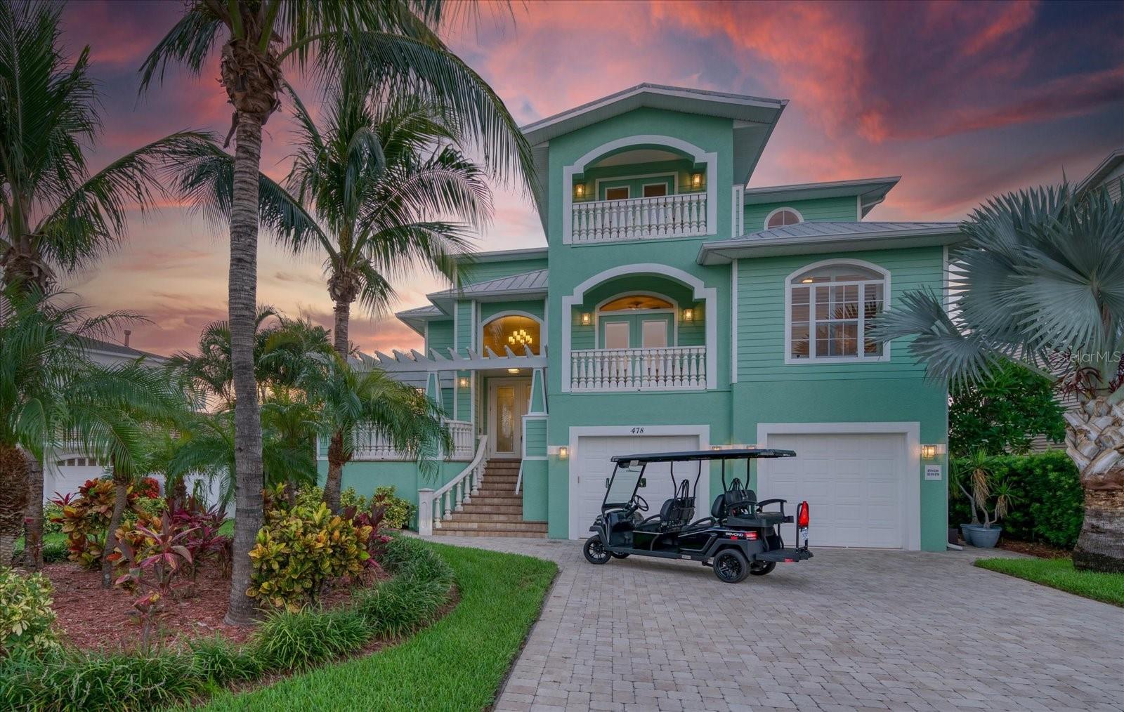 Coastal Key West Waterfront Retreat in Coveted Indian Rocks Beach. Perfectly positioned on a quiet cul-de-sac in highly sought-after Indian Rocks Beach, this Key West-inspired waterfront residence offers sweeping western water views, spectacular sunsets, and the quintessential Florida lifestyle. Built in 2015, this  4 bedroom 3 bath three-story home combines quality craftsmanship, thoughtful design, and modern conveniences in a premier waterfront setting. Designed for both entertaining and everyday living, the main level features an expansive living area and a gourmet kitchen with custom cabinetry, granite countertops, a walk-in pantry, chef's island with prep sink and cooktop, and premium stainless steel appliances. The adjoining dining and living spaces are framed by panoramic water views, creating a seamless connection between indoor and outdoor living. Thoughtful upgrades throughout include hand-scraped hardwood flooring, Travertine tile, a custom built-in entertainment center, and a private elevator providing convenient access to all levels. Two bedrooms and a full bath are located on the main living level, with one bedroom offering flexibility as a home office, den, or formal dining space. The upper level is dedicated to private living quarters, highlighted by a spacious primary suite featuring a private waterfront balcony, oversized walk-in closet, custom built-in cabinetry, and a spa-inspired bath with a jetted soaking tub positioned to capture breathtaking sunset views. An additional bedroom completes the top floor. The entry level offers a spacious two-car garage and a large flex space with sliding glass doors opening to lush tropical landscaping. Outside, the resort-style waterfront setting is designed for relaxation and recreation, featuring a heated pool, deep-water dock with 20,000lbs boat lift, expansive entertaining areas, and dedicated storage for paddleboards, kayaks, and other waterfront gear. Just minutes from the Gulf of Mexico, the property's deep-water dock and boat lift provide convenient access for boating, fishing, island hopping, and waterfront adventures.  Indian Rocks Beach is one of Florida's most desirable coastal communities, known for its golf-cart-friendly atmosphere, sugar-sand beaches, waterfront dining, parks, and family-friendly attractions. Whether you're seeking a primary residence, second home, or waterfront investment property, this exceptional residence offers an outstanding opportunity to enjoy the best of Florida coastal living while benefiting from the area's strong short-term rental demand.
