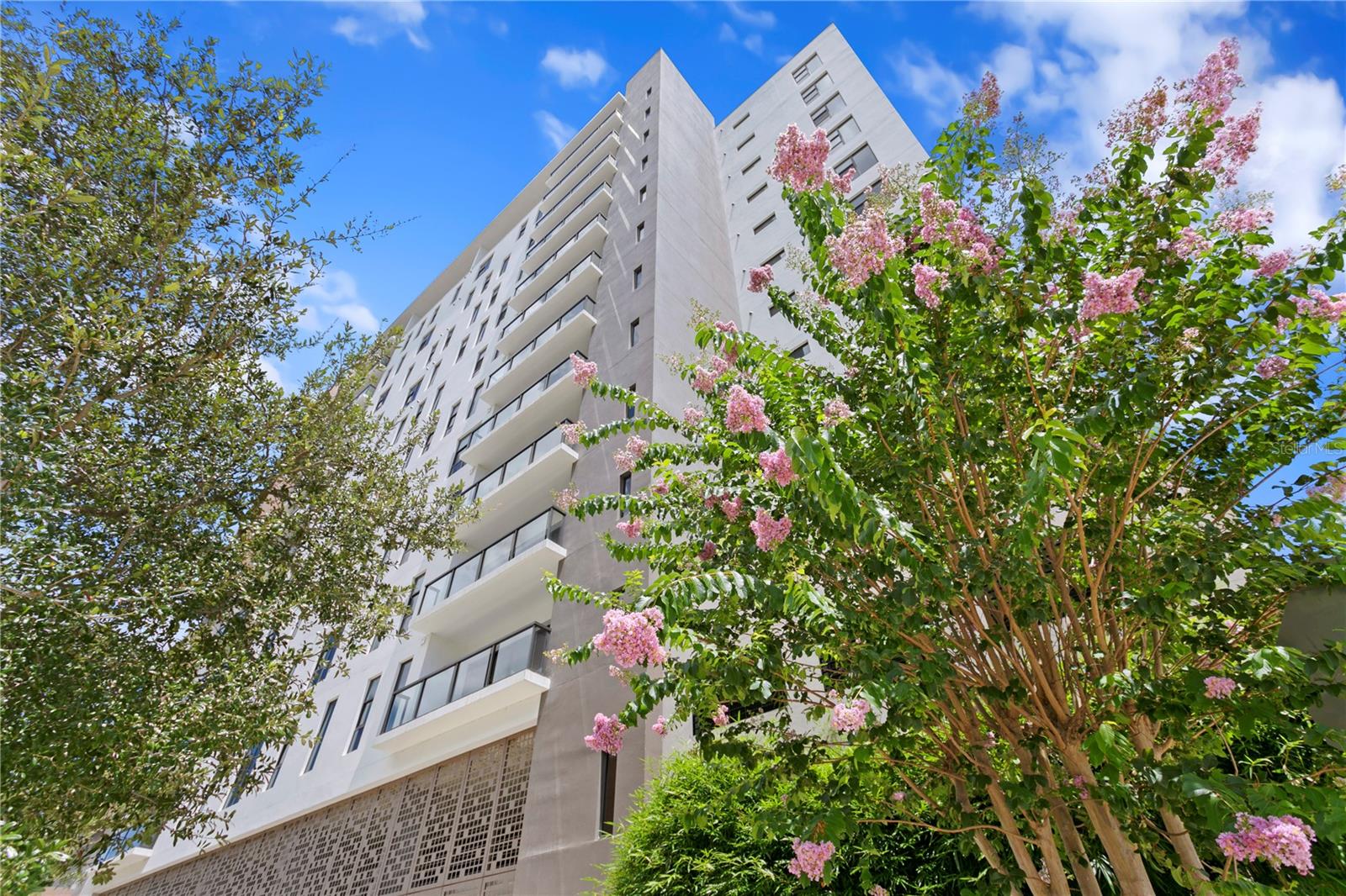 Experience the pinnacle of luxury living in this one-of-a-kind penthouse at The Salvador, a prestigious, Green Certified boutique building with just 74 exclusive residences, ideally situated in the vibrant heart of downtown St. Petersburg. This extraordinary home offers uninterrupted, panoramic views of South Tampa Bay, the Sunshine Skyway Bridge, Albert Whitted Airport, and a yacht-filled marina—delivering an ever-changing waterfront backdrop that defines true coastal elegance. From sunrise to sunset, this custom-designed residence is bathed in natural light through wall-to-wall, floor-to-ceiling windows that span every room, including all bedrooms, creating a seamless connection between indoors and out. With 2,537 square feet of sophisticated living space, this penthouse blends timeless style with
everyday comfort. Upon entering, you’re welcomed into a dramatic foyer that leads to a sunlit great room where water views take center stage. Designed with both form and function in mind, the layout offers privacy between the main entertaining areas. The kitchen and formal  
dining room are thoughtfully separated from the great room by an elegant partition wall, creating a sense of intimacy while maintaining a natural flow throughout the home. The kitchen itself is a dream for culinary enthusiasts, featuring gas cooking, premium stainless steel appliances, ceiling-height custom cabinetry, and generous counter space. A separate catering prep area adds convenience for those who love to entertain. The private primary suite offers a retreat-like atmosphere with breathtaking bay views, a spacious custom walk-in closet, and a spa-inspired en-suite bath complete with a luxurious jetted soaking tub, a large walk-in shower, dual vanities, and instant hot water. Two well appointed guest bedrooms each include their own full bathrooms, offering comfort and privacy for family or visitors. Additional flexible spaces include a richly styled library (which can be converted into a fourth bedroom), a private home office or den, and a laundry/utility room with built-in smart home features for added efficiency and ease. Refined finishes throughout elevate the experience—10'+ ceilings, designer lighting, beautifully crafted tile flooring, extensive custom cabinetry, and two gas tankless water heaters for on demand hot water. The residence also includes two assigned parking spaces within the secured, access-controlled garage. Residents of The Salvador enjoy an elevated lifestyle with resort-style amenities on the third floor amenity deck, including a heated saltwater pool and spa, a modern fitness center, stylish clubhouse, outdoor grilling station, cozy fire pit, sculpture garden, and a dog park with wash station. The building offers secured access and a peaceful, private environment while being just steps from everything downtown St. Pete has to offer—award-winning restaurants, waterfront parks, vibrant art galleries, world-class museums, marinas, the St. Pete Pier, and lively markets
and events. This is not just a home—it’s a statement in luxury, design, and location. Discover the best of city and bayfront living in one of downtown St. Pete’s most sought-after residences.