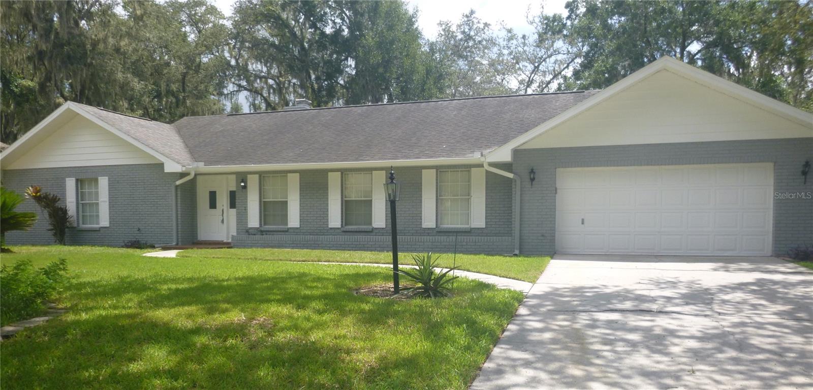 PRICE ADJUSTED. BEAUTIFUL SINGLE FAMILY RANCH STYLE HOME. WITH OVER 2200 SQ. FT. OF LIVING AREA. FRESHLY PAINTED INTERIOR AND EXTERIOR. TILED FLOORS THROUGHOUT. 3 BEDROOM 2.5 BATHS. 2 CAR GARAGE. LIVING ROOM, DINING ROOM, HUGE KITCHEN, FAMILY ROOM WITH FIRE PLACE. EAT-IN AREA IN KITCHEN, NEWER KITCHEN APPLIANCES. STOVE, REFRIGERATOR, MICROWAVE, DISHWASHER, HUGE SCREENED LANAI, FENCED IN YARD, TREES. GREAT SCHOOLS. ****At time of move-in, Tenant costs will include a processing fee of $125.00 along with rent and any deposit****