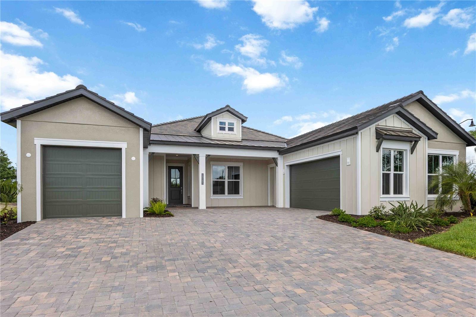 RARE OPPORTUNITY TO OWN THE VERY LAST BRAND NEW HOME IN GRAN PLACE!!  Welcome to Gran Place at Wellen Park - an exclusive Sam Rodgers Homes private enclave of just 42 custom homes. Introducing the Destin Modern Farmhouse-Completed Quick Move-In Home. This 2,932 sq. ft. home offers 3 bedrooms, 3 baths, a bonus room, den/office, with PGT impact glass windows and doors and oversized 2-car garage + separate 1 car garage. Outdoor living shines with a private pool, spa, outdoor kitchen, spacious paver lanai, and peaceful preserve and palm views. Inside, the open great room design is anchored by a gourmet kitchen featuring an oversized center island, quartz countertops, built-in stainless steel appliances, soft-close wood cabinetry, and a natural gas cooktop-perfect for hosting family and friends. The private primary suite boasts dual walk-in closets and a spa-like bath with dual vanities and a soaking tub. Gran Place is a natural gas community designed with chefs and entertainers in mind. Sam Rodgers Homes is known for unmatched quality and craftsmanship that speaks for itself. As a resident, you'll also enjoy exclusive membership opportunities with Plantation Golf & Country Club. Through this special partnership, Gran Place homeowners can access private membership incentives available only to our community, with amenities including: Two championship 18-hole golf courses, Expansive practice facilities, Jr. Olympic-sized pool, 24-hour fitness center, 12 Har-Tru tennis courts, 6 pickleball courts, Bocce courts, Multiple dining venues and year-round social events. Beyond Gran Place, the Downtown Wellen District offers waterfront dining, boutique shopping, entertainment, and year-round events across 175 acres. Residents enjoy a 3-mile health and wellness trail, food truck arena, splash pad, playground, activity lake with paddle boards and kayaks, plus over 20 miles of scenic nature and fitness trails. With easy access to major highways, world-class beaches, Downtown Venice, and Downtown Sarasota are all within reach. Families will also appreciate proximity to top-rated Sarasota County schools. The Destin Farmhouse delivers everything you want-and more-in one of Venice's most desirable new communities.