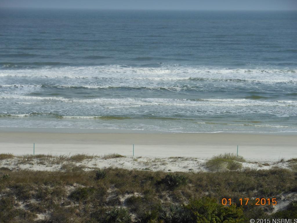 THERE ARE ULTIMATE UPGRADES IN THIS 7TH FLOOR SE CORNER 4/3 COQUINA FLOOR PLAN THAT OFFERS EXCEPTIONAL PANORAMIC VIEWS TO THE OCEAN AND WHITE SANDY BEACH TO THE SOUTH. THIS CONDO HOME ABOUNDS WITH CUSTOM FEATURES THAT BEGIN WITH LARGE TRAVERTINE FLOOR TILE THROUGHOUT, GRANITE TOPS & BACK SPLASH, BUILT-IN ENTERTAINMENT CENTER WITH SURROUND SOUND AND DINING AREA WITH A HUGE BUILT-IN CHINA CABINET. THE MASTER BEDROOM HAS A BUILT-IN VANITY WITH REFRIGERATOR AND MICROWAVE. THE MASTER BATH HAS GRANITE AND A DOUBLE HEAD SHOWER WITH MOSAIC FLOOR MEDALLION. THE EAT IN KITCHEN HAS A INDUCTION STOVE TOP, CONVECTION OVEN, GRANITE TOP ISLAND, BUILT-IN CLOSET SIZE CUSTOM WINE COOLER AND MORE. THE SECOND BEDROOM HAS A WALL WITH BUILT-IN BOOK CASE AND COMPUTER AND IS PRESENTLY BEING USED AS AN OFFICE. THE THIRD BEDROOM HAS AN ATTACHED BATH AND THE 4TH BEDROOM HAS A MURPHY BED WITH EXTRA STORAGE CABINETS. THIS CONDO HOME HAS TO BE SEEN TO FULLY APPRECIATE AS THE CUSTOM UPGRADES ARE TO NUMEROUS TO LIST. COME SEE AND YOU'LL AGREE THIS IS A ONE OF A KIND HOME IN THE EXCLUSIVE DUNES HOA THAT HAS IT'S PRIVATE OCEAN WALKOVER AND POOL/SPA WITH OWNERS RIGHTS TO ALSO USE THE COMMUNITY POOL/SPA BY THE CLUBHOUSE AND TENNIS COURTS. THIS CONDO CAN BE THE PERFECT PERMANENT RESIDENCE OR FLORIDA GET-A-WAY FOR FUN AND RELAXATION. (TO SEE VIRTUAL TOUR-CLICK YELLOW VT AT TOP OF LISTING-TO NAVIGATE CLICK AND HOLD & MOVE THROUGHOUT CONDO) ;LocationDescription: Condo ;Water: City