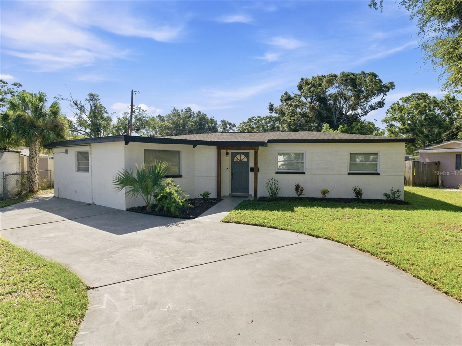 A rare opportunity in Meadowlawn: a fully remodeled 4-bedroom, 3-bath home with two private primary en-suites, a true split-bedroom floor plan, and no required flood insurance. At the time of listing, this is the only 4-bedroom, 3-bath home available in the area under $500,000.

The light-filled interior has been redesigned with a refined European influence, combining clean architectural lines, warm white-oak-toned flooring, modern LED lighting, and an open layout that feels spacious and cohesive. The expanded kitchen features new appliances, contemporary cabinetry, generous workspace, and a dedicated pantry—creating a highly functional centerpiece for the home.

Two separate en-suite bedrooms provide exceptional flexibility for multi-generational living, extended-stay guests, a private office arrangement, or anyone seeking additional separation and privacy. All three bathrooms have been thoughtfully renovated with modern tile, streamlined fixtures, and elevated finishes.

Major improvements include a newer roof, updated HVAC system, renovated kitchen and bathrooms, new flooring, updated lighting, fresh landscaping, and an exterior storage shed. Large windows and multiple exterior doors bring in abundant natural light while enhancing the home’s open, airy character.

Located in the high-and-dry section of Meadowlawn, the property is outside the designated flood zone, offering the significant financial advantage of no required flood insurance. The neighborhood is well suited for biking and is close to restaurants, shopping, grocery stores, schools, I-275, downtown St. Petersburg, and Tampa. Sawgrass Lake Park and its wildlife-viewing boardwalk are also nearby.

A distinctive combination of layout, privacy, design, location, and value that is difficult to duplicate at this price point. Buyer to verify measurements, school information, flood-zone designation, and all property details.