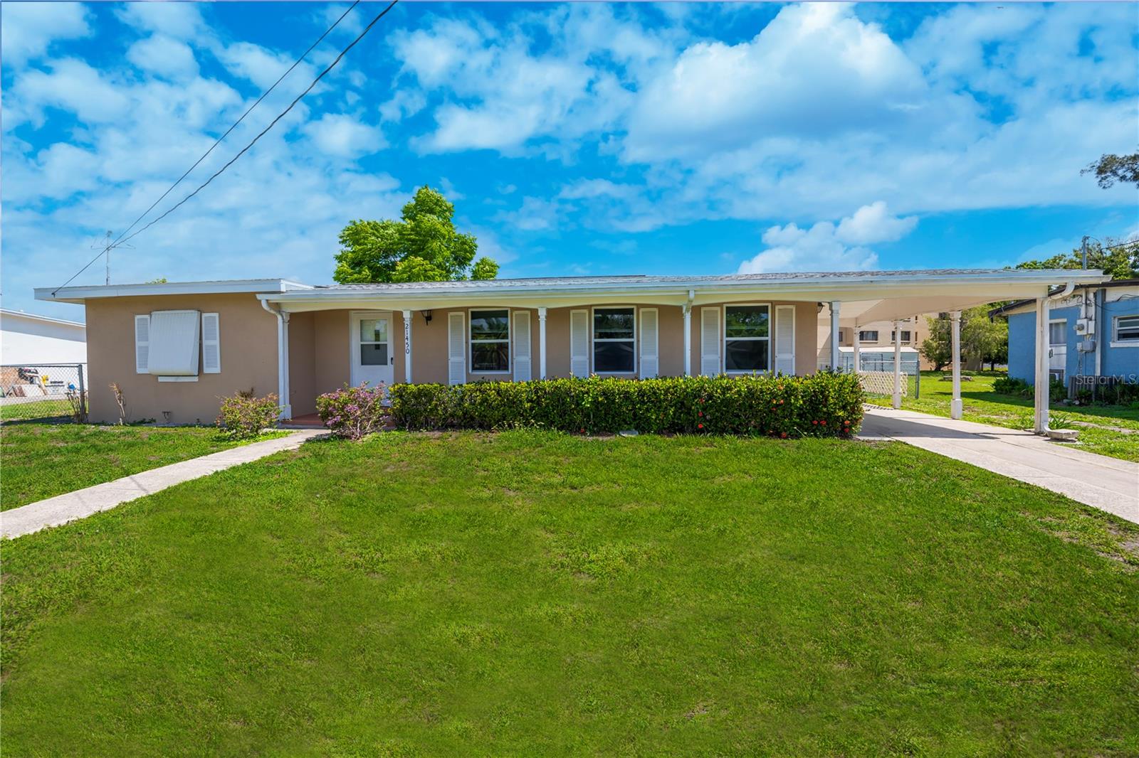 One or more photo(s) has been virtually staged. DON'T MISS this INCREDIBLE OPPORTUNITY in the heart of Port Charlotte! This fantastic 2 bedroom, 1 bathroom home offers spacious living with a huge 20x10 carport and an extra long driveway that provides plenty of parking.The charming curb appeal welcomes you with mature landscaping, a wide open-air covered front porch perfect for relaxing, and inviting sidewalks plus NOT IN A FLOOD ZONE.Step inside to an open floor plan featuring a large living room, a separate dining room, and a cozy family room complete with built ins. Beautiful tile flooring flows throughout the main living areas, combining style with easy care. The kitchen is a true highlight, showcasing granite countertops, a stunning herringbone tile backsplash, shaker style cabinetry, a breakfast bar, a ceiling fan, and a skylight flooding the space with natural light.The modern bathroom has been tastefully updated and is conveniently located between two generously sized bedrooms. Ample storage abounds, including a laundry room with washer and dryer access through a convenient exterior door. Enjoy the spacious 15x12 screened rear porch perfectly positioned to capture refreshing cross breezes any time of day or night.There is plenty of room for a pool in the sprawling fenced backyard, ideal for family gatherings, entertaining, pets, and more. Additional features include rain gutters, city water and sewer, no HOA, and no deed restrictions, this home offers freedom and flexibility.All this, just minutes from shopping, dining, medical care, entertainment, waterfront parks, boat ramps, fishing piers, and a short drive to the vibrant and historic downtown Punta Gorda. This opportunity won’t last so schedule your showing today and make this your new home!