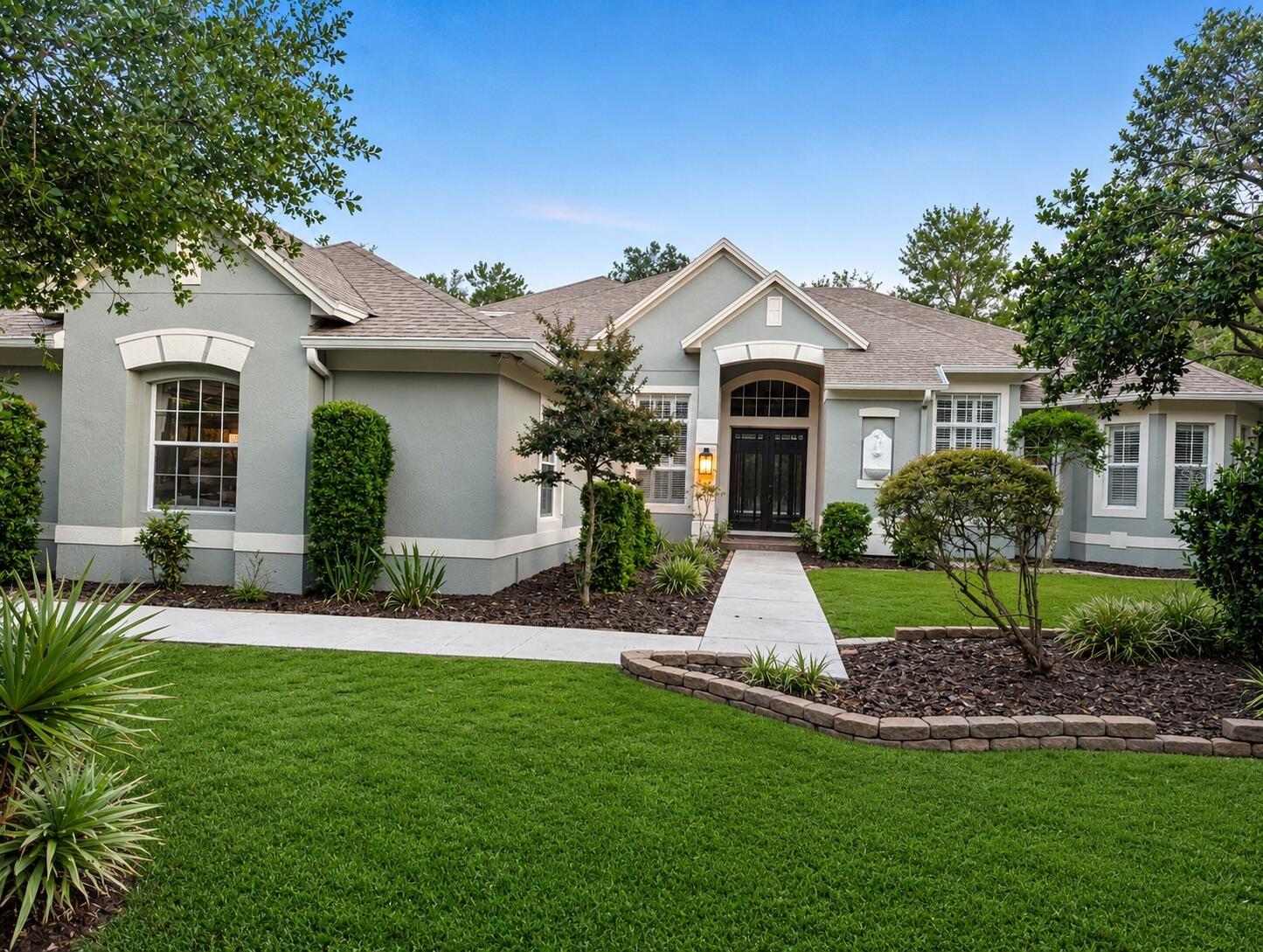 One or more photo(s) has been virtually staged. Welcome to your private resort-style retreat in the heart of Seminole Woods. Situated on 5.2 high-and-dry acres, this custom 4-bedroom, 3-bath estate is the perfect blend of luxury, privacy, and outdoor living in one of Geneva's most sought-after communities.

From the moment you arrive, you'll appreciate the peaceful setting, mature trees, and sense of space that make Seminole Woods so desirable. Inside, the home has over 3,300 square feet of thoughtfully designed living space featuring soaring ceilings, abundant natural light, generous living areas, and a beautifully appointed kitchen with granite countertops, custom cabinetry, a large center island, and professional-grade appliances.

Step outside to discover your own private backyard paradise. The resort-style pool and spa create an exceptional setting for entertaining, relaxing, and enjoying Florida's year-round sunshine. Whether hosting friends and family, spending afternoons poolside, or unwinding beneath the stars in the spa, this outdoor space was designed for making memories.

Beyond the pool, the property truly comes to life. Nearly a half-mile of private trails wind throughout the acreage, inviting you to explore your own estate on foot, horseback, or by golf cart. The natural landscape provides a peaceful backdrop where wildlife is often seen, creating a unique connection to the beauty of Old Florida.

With over five acres of usable land, there is ample room for horses, recreational vehicles, future outbuildings, gardens, or simply enjoying the privacy and freedom that acreage living provides. Opportunities to own a property that combines luxury living, resort-style amenities, private trails, and expansive acreage are increasingly rare.

Conveniently located near Oviedo, Sanford, UCF, and Orlando, this exceptional Seminole Woods estate embodies the tranquility of country living without sacrificing access to modern conveniences.
