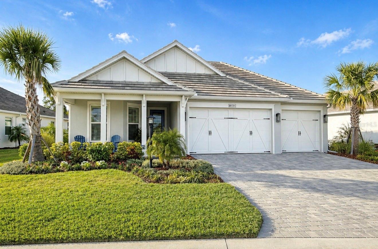 A truly RARE OPPORTUNITY in Lakehouse Cove!   Thoughtfully designed and CUSTOM BUILT for maximum use of space, comfort and everyday functionality, this exceptional 4-BEDROOM, 2.5 BATH, 3 CAR GARAGE offers over 2400 square feet of living space on an OVER-SIZED LOT that backs to a gorgeous, permanent preserve/conservation area for privacy, beauty and serene natural views.  Designed with both elegance and livability in mind, this home features extensive upgrades, including HURRICANE IMPACT WINDOWS,  upgraded tile flooring throughout, tray ceilings, detail custom trim work and ceiling beams, built-in closet systems, a beautiful custom fireplace in the great room and a WHOLE-H0USE WATER FILTRATION SYSTEM.  The gourmet kitchen is equally impressive, offering upgraded quartz countertops, a gas cooktop, built-in wall ovens with convection microwave and refined touches that make the space as functional as it is beautiful.  A spacious primary suite overlooks serene preserve views, and offers a large walk in closet with custom built-ins and a spa-like primary bath.  This flexible floor plan includes a LARGE 4TH BEDROOM or bonus room, creating versatility for guests, home office or media room.  Every detail was thoughtfully considered to create a home that is spacious, elegant, comfortable and highly efficient.  Professionally decorated throughout, all furnishings are negotiable with a turn-key furnished option, making this a rare and effortless move-in opportunity in one of Lakewood Ranch's most desirable waterfront communities.  Residents of Lakehouse Cove enjoy a 7-acre waterfront amenity site that includes six pickleball courts, club house, state of the art fitness center, resort style pool, boat house and kayak launch, event lawn, two dog parks and more.  Just a short stroll is the extended community of Waterside Place with vibrant restaurants, shopping and a weekly farmer's market and street festival.