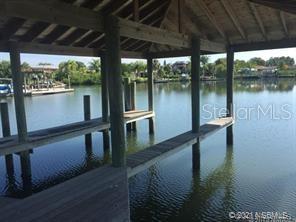 Now is the time to bulid your Dream Home with access to the IntraCoastal in the Highly desired Inlet Shores subdivision. This prime location is Located directly on the Intracoastal waterway and minutes to access the Atlantic Ocean and Ponce Inlet.  

A large Single Family Home can be built on the Uplands portion of the 97.24 acre lot, mostly wetlands / Bufferzone  that provides privacy now and in the future. Buildable area on the Uplands portion deemed to be approx. 0.75 acres.
Deeded Deep water access from the covered boat dock / slip for one (1) boat served by a wooden walkway from your backyard. Imagine the view from your new home on this lot - with easy access to some wonderful boating opportunities.  
Easy access to New Smyrna Beach and it's vibrant local owned dining, entertainment and shopping.

Call today... this property will not last long!!! All information is intended to be accurate but is not guaranteed. Measurements should be verified by the prospective buyer.; Cleared: Partial ;Water: Available at Site